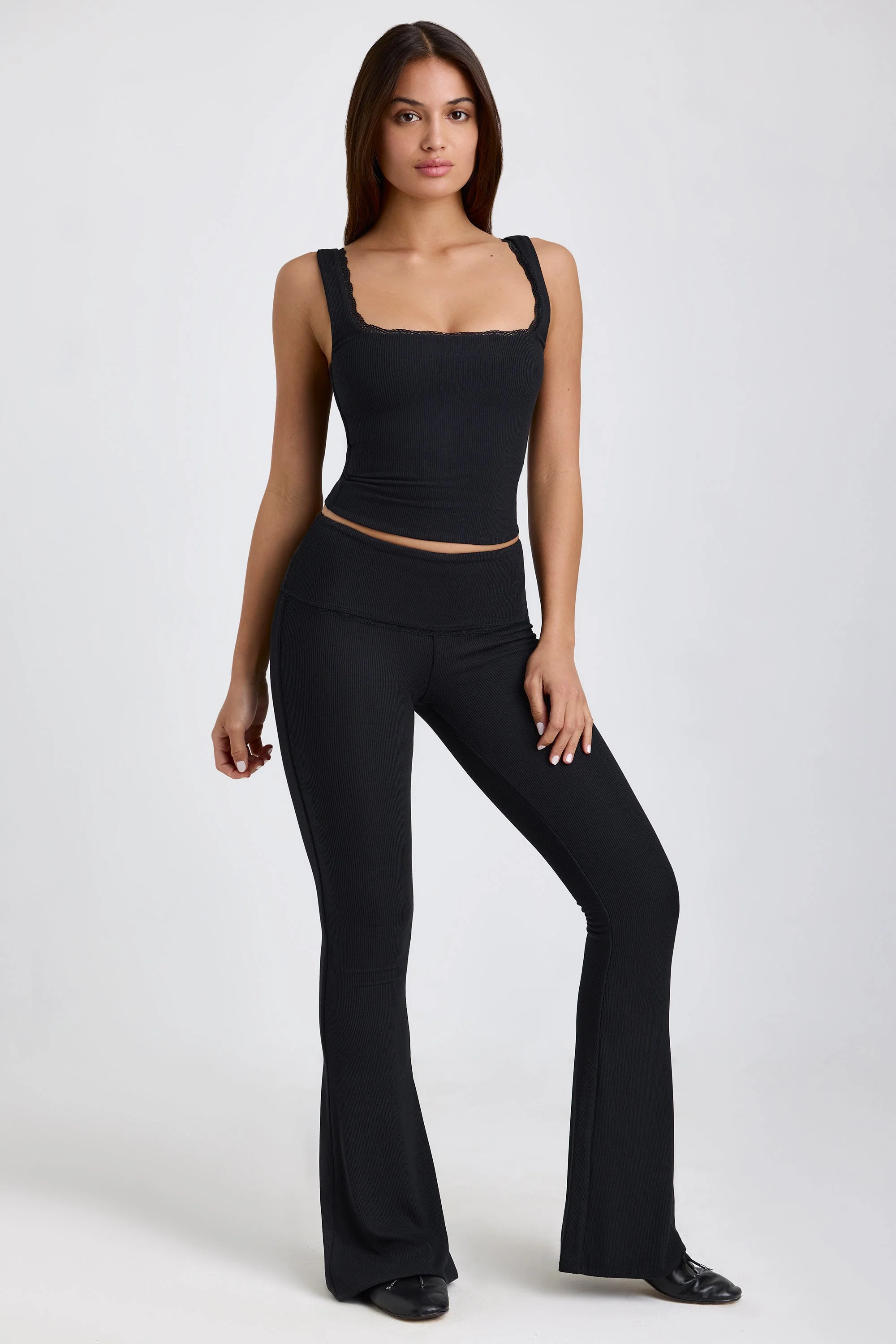 Ribbed Modal Mid-Rise Foldover Flared Trousers in Black | Oh Polly