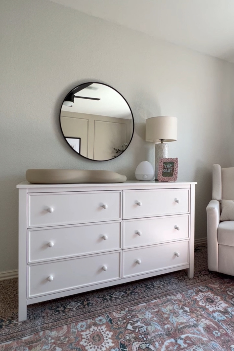 Nursery dresser and round mirror 