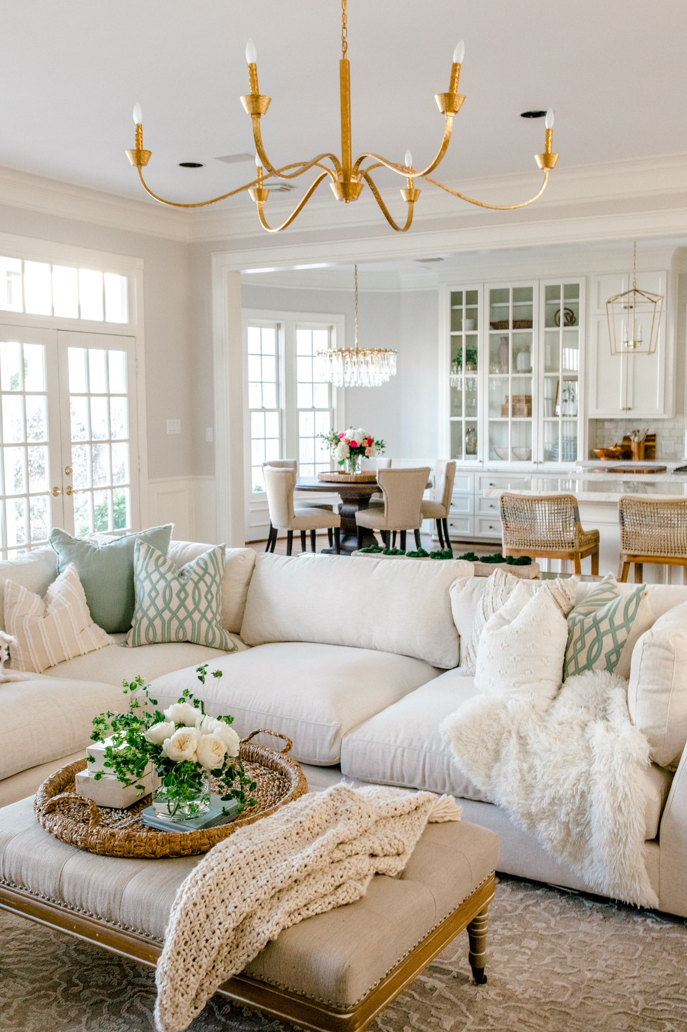 Family room, large, gold chandelier, XL chandelier, crystal brown chandelier, lanterns for kitchen, large white performance, fence, fabric sofa, woven tray, coffee, table styling tufted, ottoman, coffee, table, round baskets for storage, round dining table open family room styling 

DM me on Instagram for a link to performance fabric sofa  

#LTKhome #LTKunder100 #LTKFind