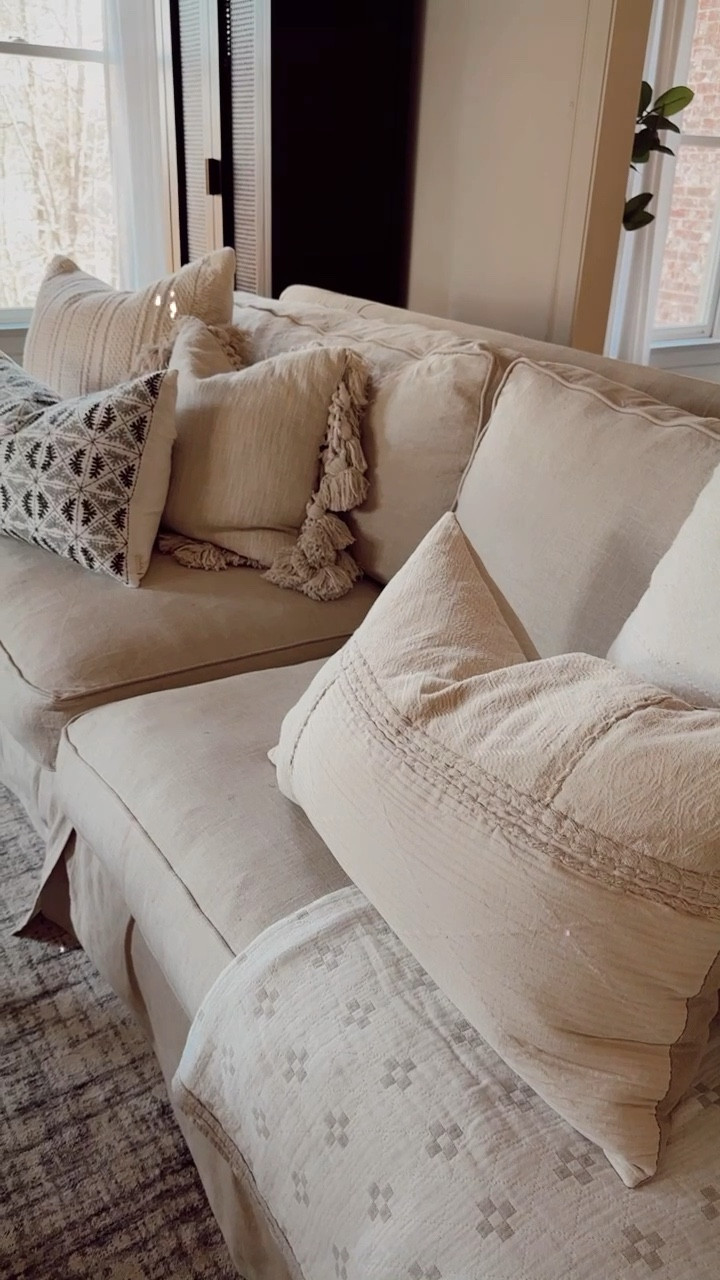 Living room with sofas and pillows for Spring // add pillows with texture for a great neutral look and the cute green pillow gives a splash of color! 

#LTKFind #LTKSeasonal #LTKhome