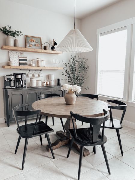 Round table is from NFM. Shelves were a diy. I painted the cabinet Iron Ore by SW 

Kitchen decor, dining room, round dining table, black chairs, transitional design, coffee bar, floating wood shelves 

#LTKunder100 #LTKunder50 #LTKhome