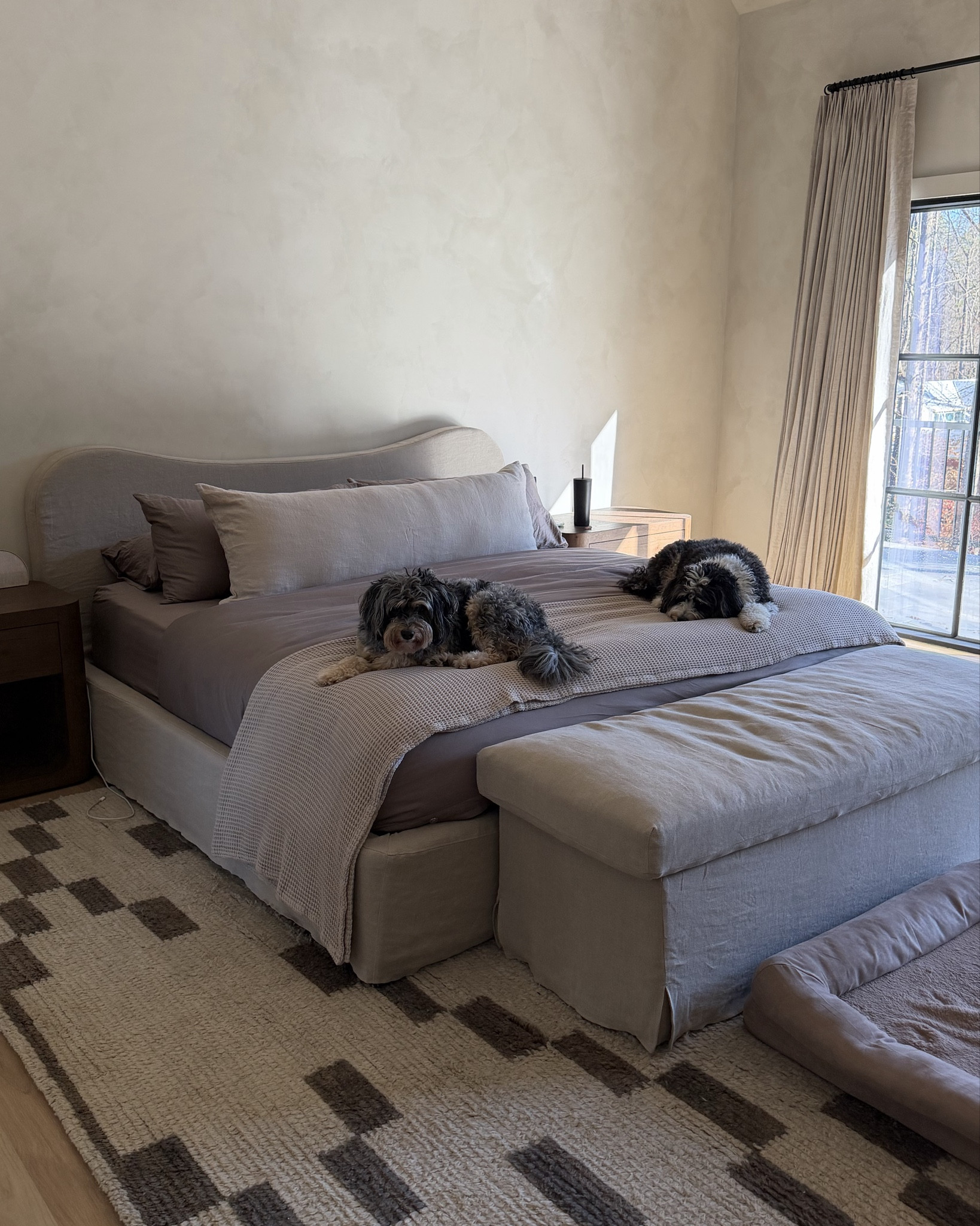 Brooklinen bedding in the color “oak”, Brooklinen throw blanket in the color “pebble”, and parachute lumbar pillow in the color “natural"