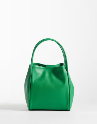 \u203a ASOS DESIGN faux leather bucket cross body bag in green | ASOS (Global)