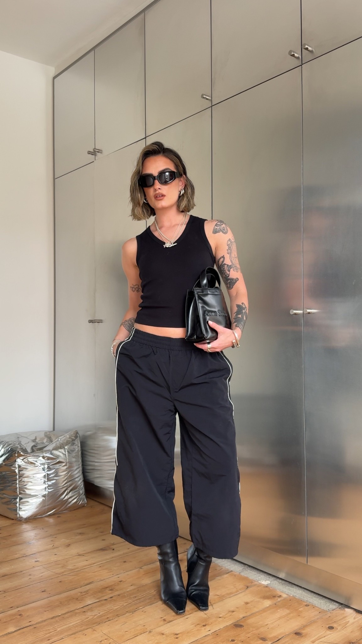 Sporty capri, track pants, black vest, v neck topp

#LTKspring #LTKsummer #LTKuk