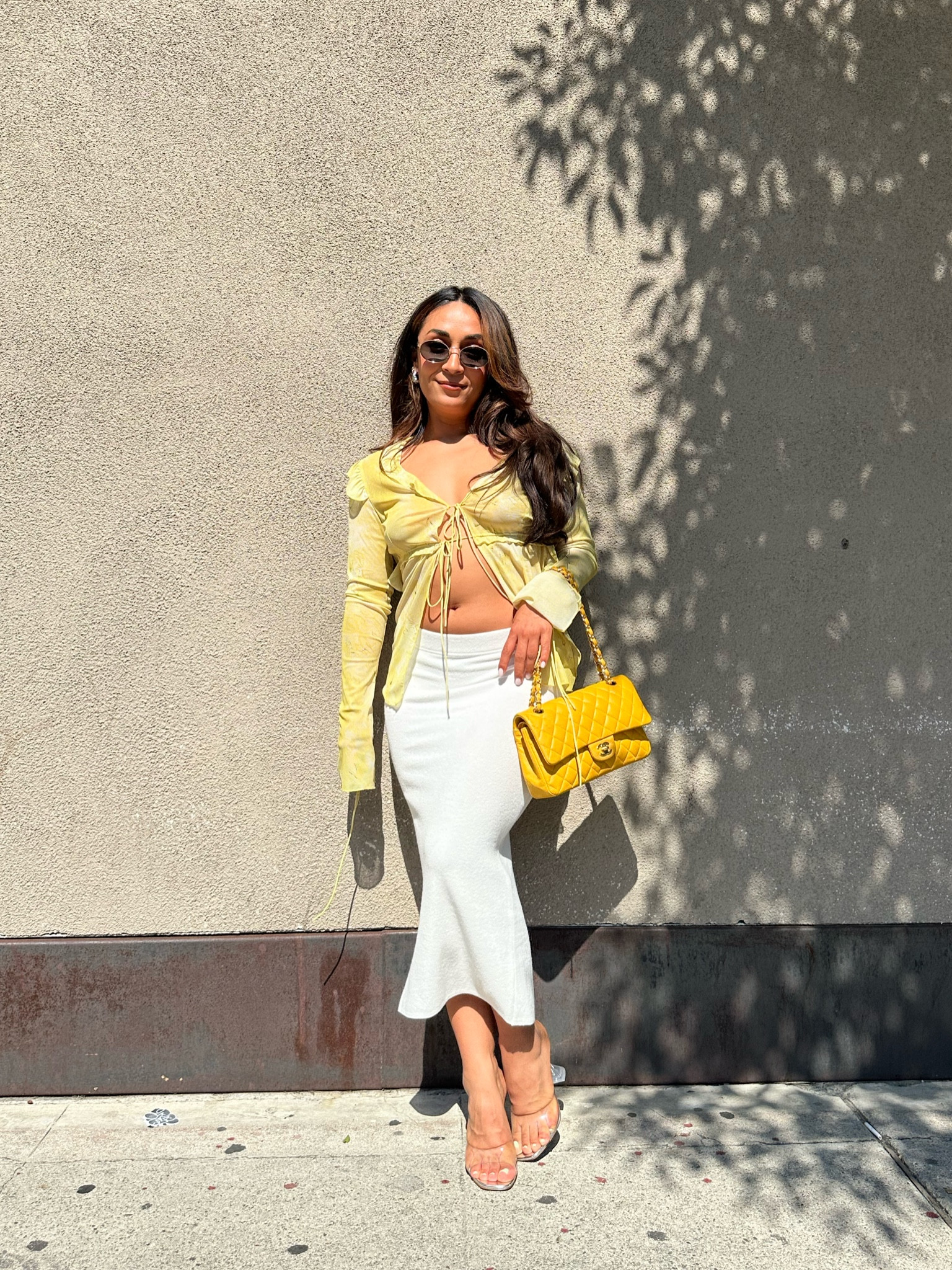 Summer outfit idea with a midi skirt. This yellow too is an Amazon find and paired it with a midi skirt and clear heels for an elevated feel.

#LTKstyletip #LTKunder50