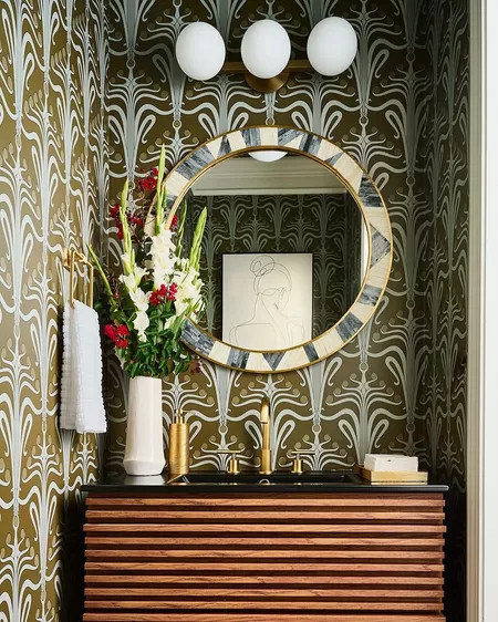 #WallpaperWednesday ✨

A little wallpaper can go a long way. This bold pattern transforms a simple powder room into a statement space filled with character, depth, and timeless style. 🤎

#LTKHome #WallpaperWednesday #SoulfulMaximalism #PowderRoomDesign #WallpaperInspiration #HomeDecor #InteriorDesign #StatementWalls 

 #LTKHome