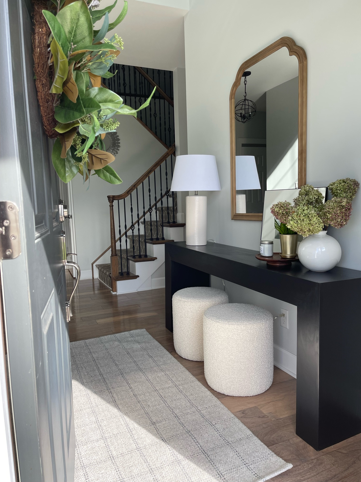 Entryway decor, console table, wall mirror, plaid rug, boule seats

#LTKFind #LTKstyletip #LTKhome