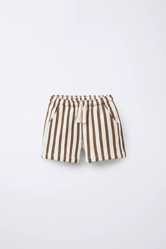 Plush Bermuda shorts with an elastic waistband and adjustable drawstrings. Front pockets and a pa... | Zara UK