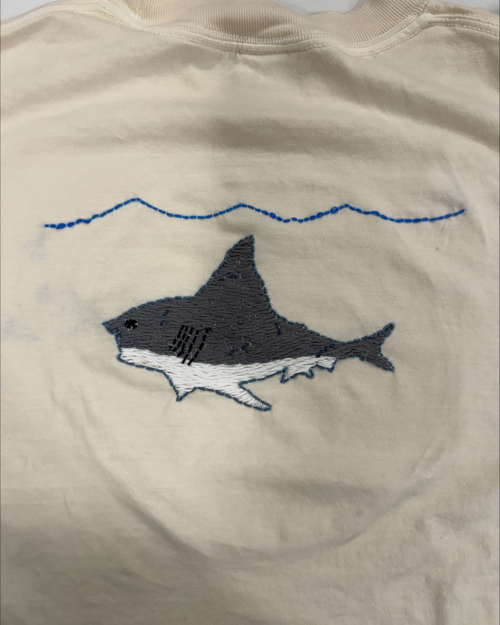 Everything I used to make these shirts for the kids is linked.

1. I have them draw a picture. 
2. I then use the light board under the t shirt to sketch it onto the shirt with a special washable marker- the slightest bit of water erases it so it’s easy to correct mistakes and then it washes away once your done embroidering. 

After I’ve traced it onto the shirt, I embroider! 