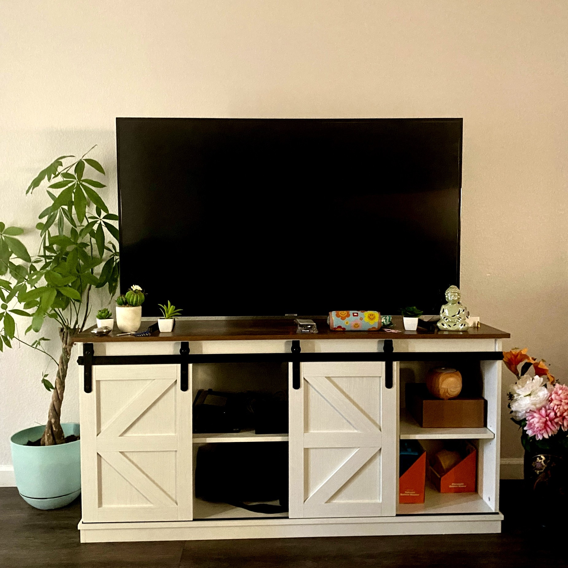 TV console with shelves. This tv stand is beautiful & functional. The doors slide to hide sections. I just flew to help my daughter set up her new apartment. Not styled fully yet had to show you. 

#LTKHome