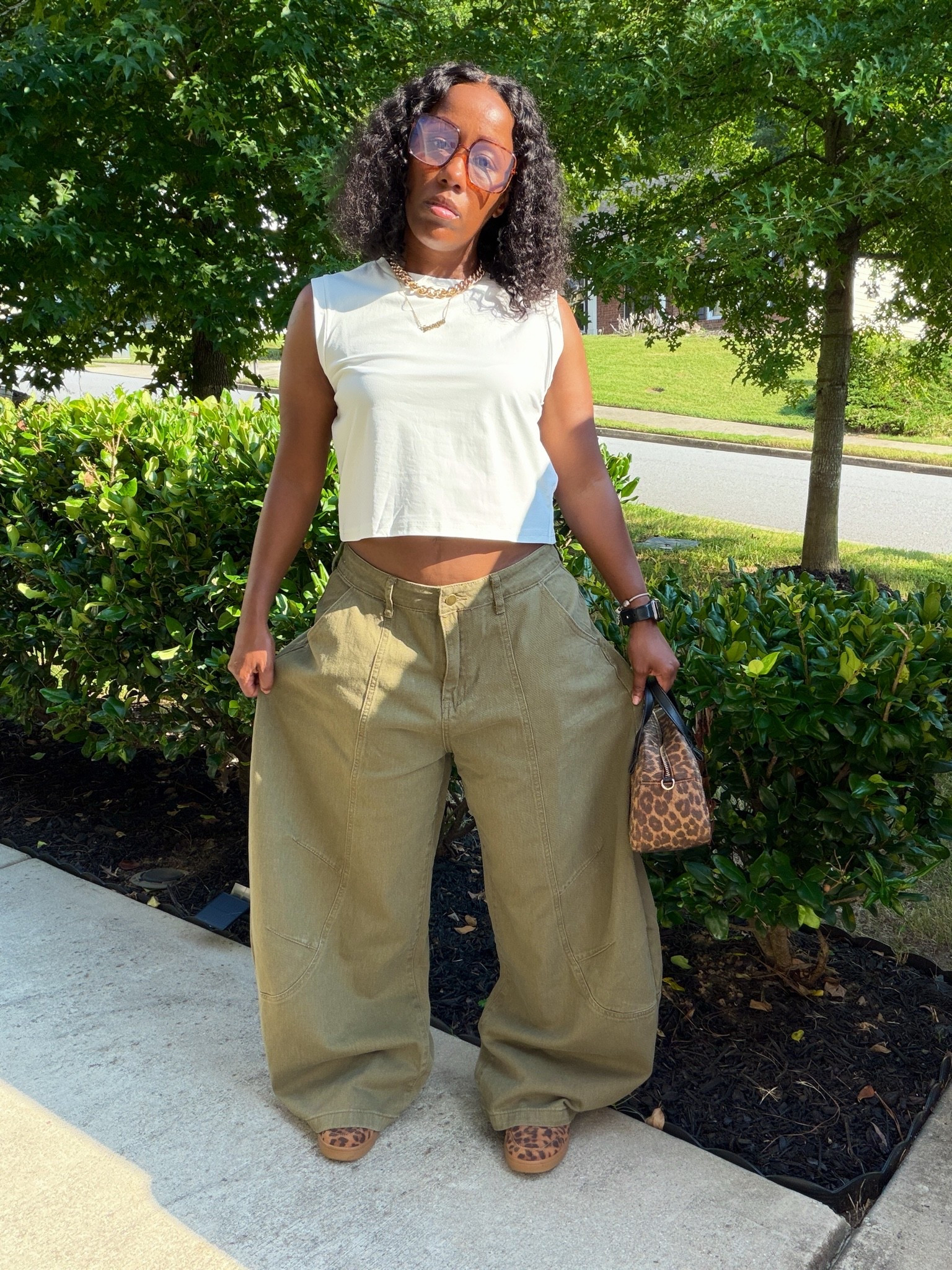 An easy way to style olive green pants with sneakers for fall. I kept the outfit simple with a white top and added leopard sneakers and a leopard bag to give the look a little more personality. Shop the pieces from this casual fall outfit down below.

#LTKootd #LTKOver40 #LTKPetite