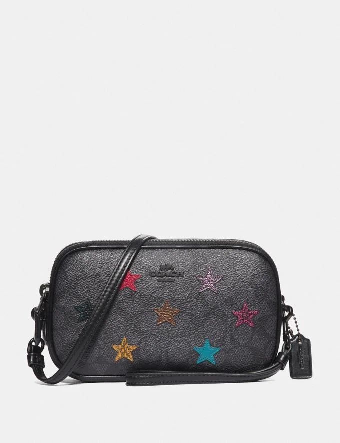 Sadie Crossbody Clutch in Signature Canvas With Star Applique and Snakeskin Detail | Coach (US)