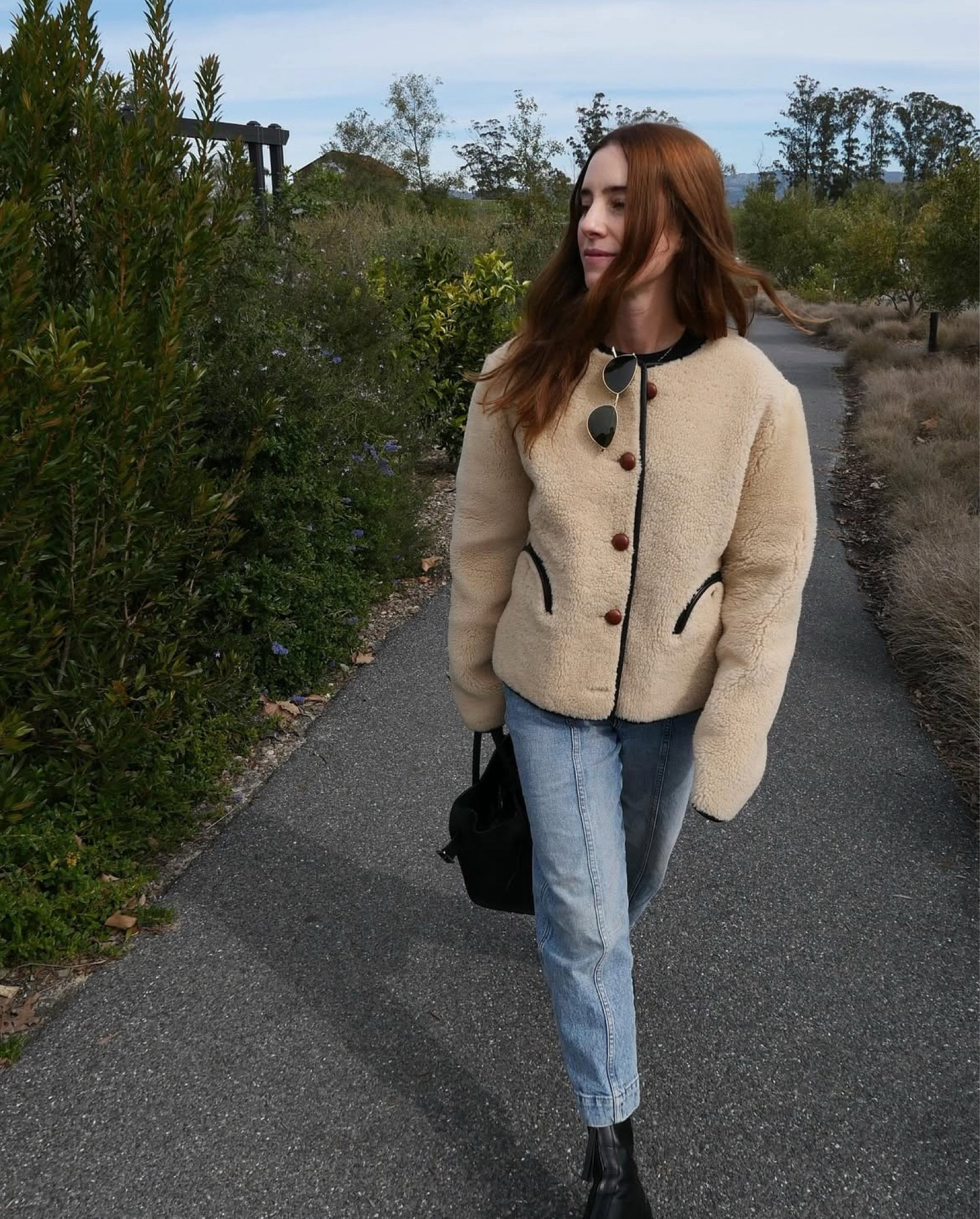 Teddy bear layers. Soaking up that winter vitamin D. Jeans are older Khaite but I linked similar!