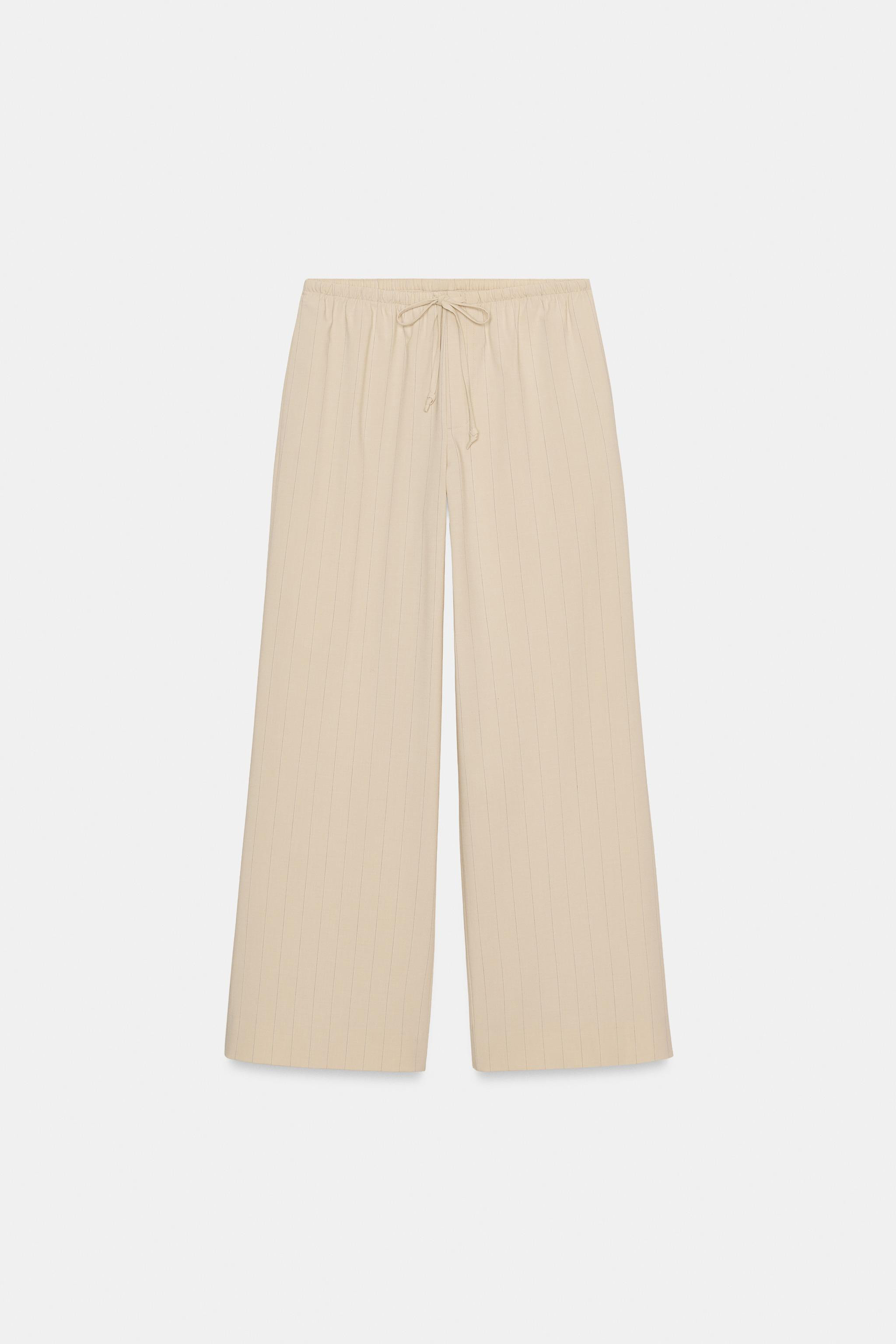 ZARA WOMAN COLLECTIONPants made of 28% viscose yarn. Mid-rise waist with adjustable elastic draws... | Zara US