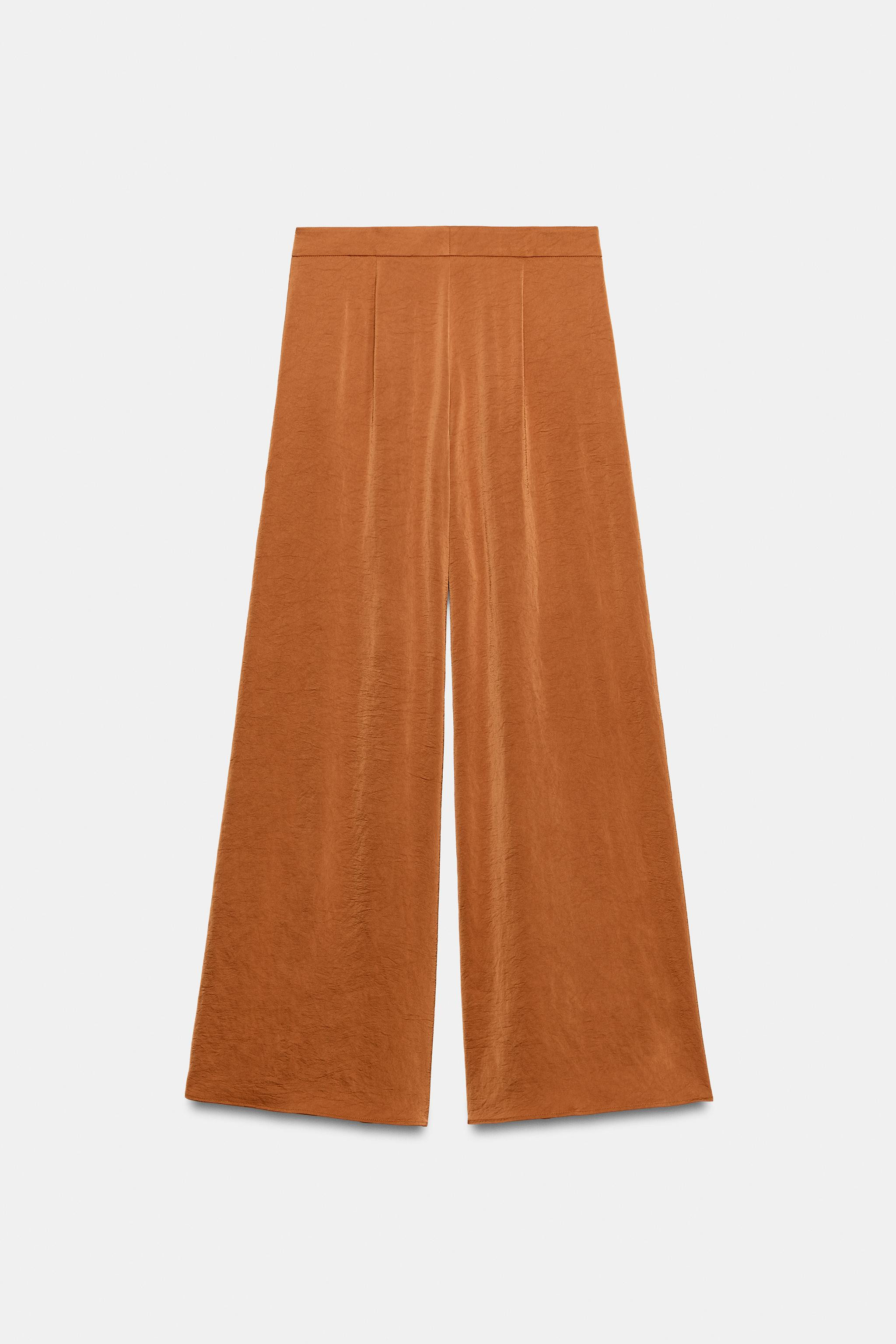 High-rise trousers with front pockets. Features a wide-leg fit with ruffle details. Front closure... | Zara US