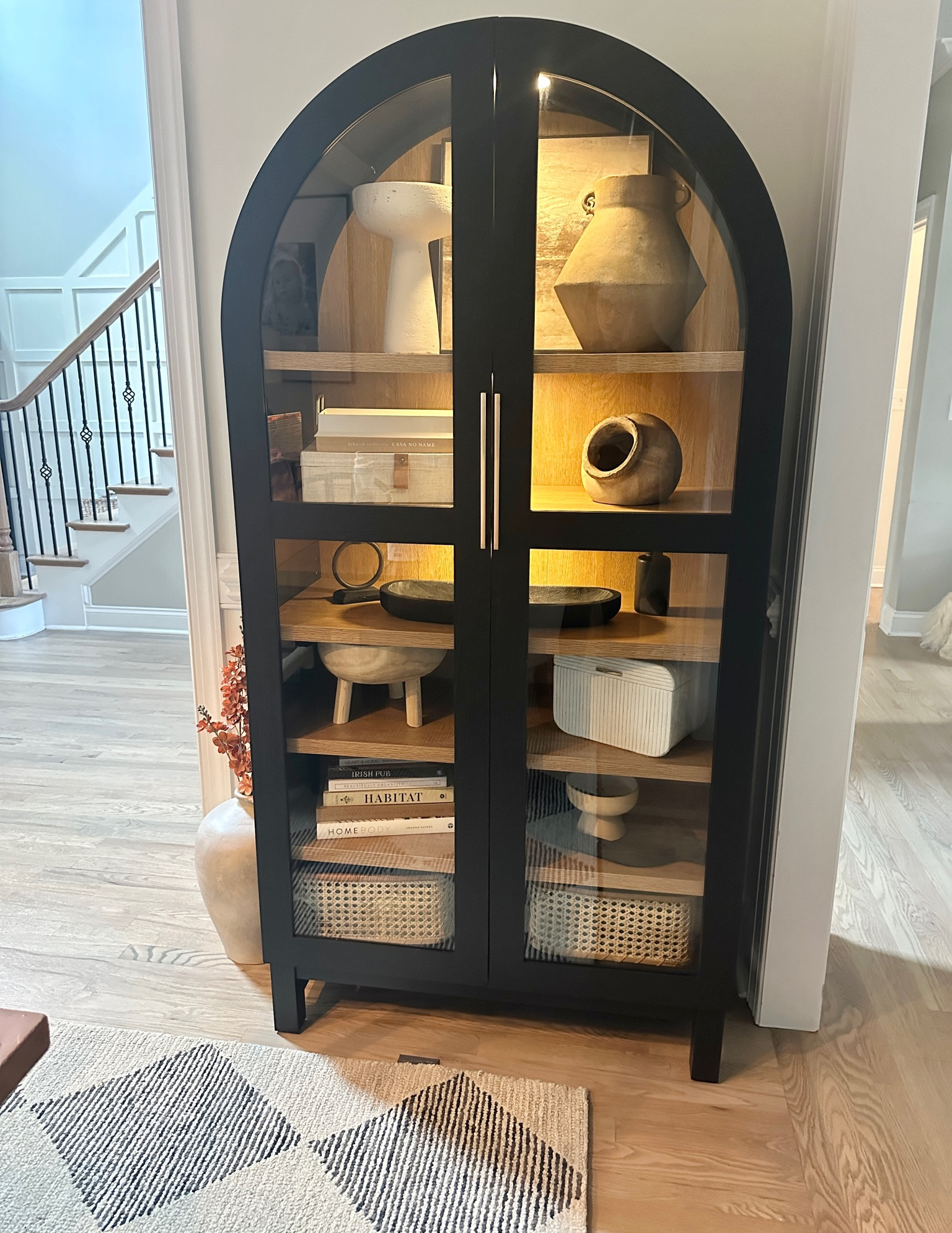 BACK IN STOCK!

Can you believe this arched cabinet is only $398 from Walmart?! 🤩

It’s a beauty, but I didn’t love the handles that it came with, so I changed them out to these beautiful affordable brass ones I found on Amazon and elevated the look even further with rechargeable battery operated puck lights, also from Amazon!

This cabinet has been sold out for months, so I am sure it will sell out fast again.  It comes in an oak color, and the scale is so good! 36 in W x 16.375 in D x 72.25 in H - so very similar to other designer options that are 5-10x this price!

It’s does not come assembled, so prepare to take time to assemble, but it’s so worth it as it’s a nice and sturdy and looks so high end!

This spot in my dining room was the perfect spot for it, and I’m loving how it compliments my other black accents in my space - and now love it even more with the extra touches I made! 



#homedesign #homestyle #homestyling #interiordesign #walmarthome #walmartfinds #archedcabinet #cabinet #cabinetstyling #affordablehomedecor #homedecor #homestyling  #neutralhome #myneutralhome #homedecorating #homedecorfinds #livingroomdecor #livingroom #bedroomdecor #diningroomdecor #organicmodern #modernorganic #ltkhome

#LTKSaleAlert #LTKHome