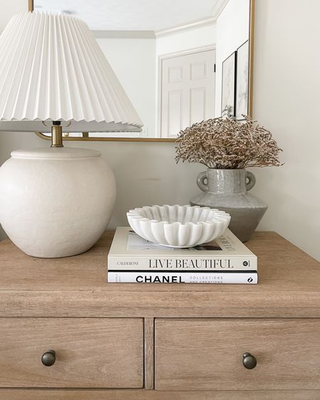 Neutral and classic nightstand styling: marble bowl, white ceramic lamp, coffee table books, vase and dried stems 

#amazonfinds #founditonamazon #target #potterybarn #homedecor 

#LTKunder100 #LTKFind #LTKhome