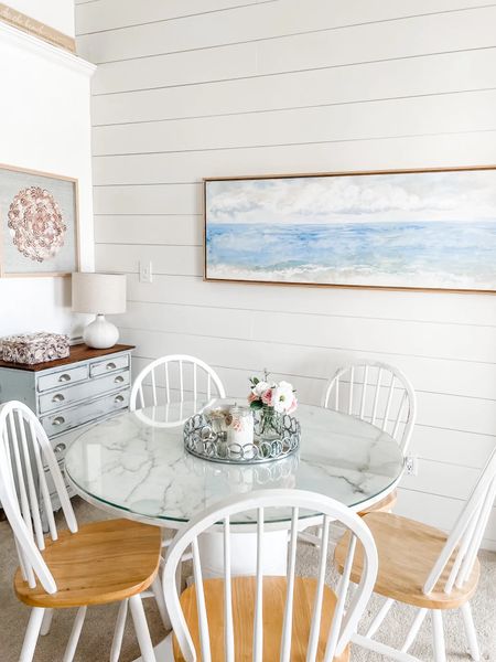 This abstract coastal canvas wall art is just what this shiplap wall needed in our beach condo!

Ceramic lamp, table lamp, canvas art, water landscape art, wall art, coastal decor. Coastal wall art, beach home, beach decor, Target lamp. Lindsay Letters abstract wall art, Crystal Tide watercolor canvas art. Round pedestal dining table, spindle back dining chair set, natural wood dining chair. White dining chair, jute area rug, neutral rug, natural rug.
#target #wallart #diningtable 

#LTKhome #LTKstyletip #LTKFind