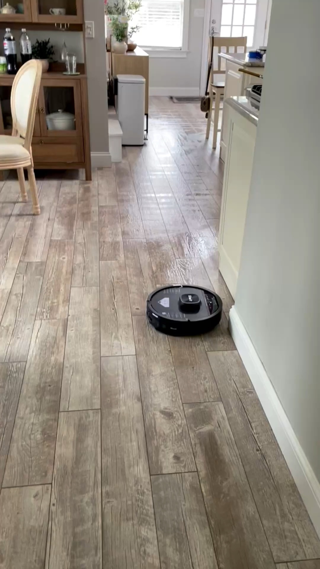 Sweep and vaccuums. Will go over extra dirty spots and scrub them! 


#ad