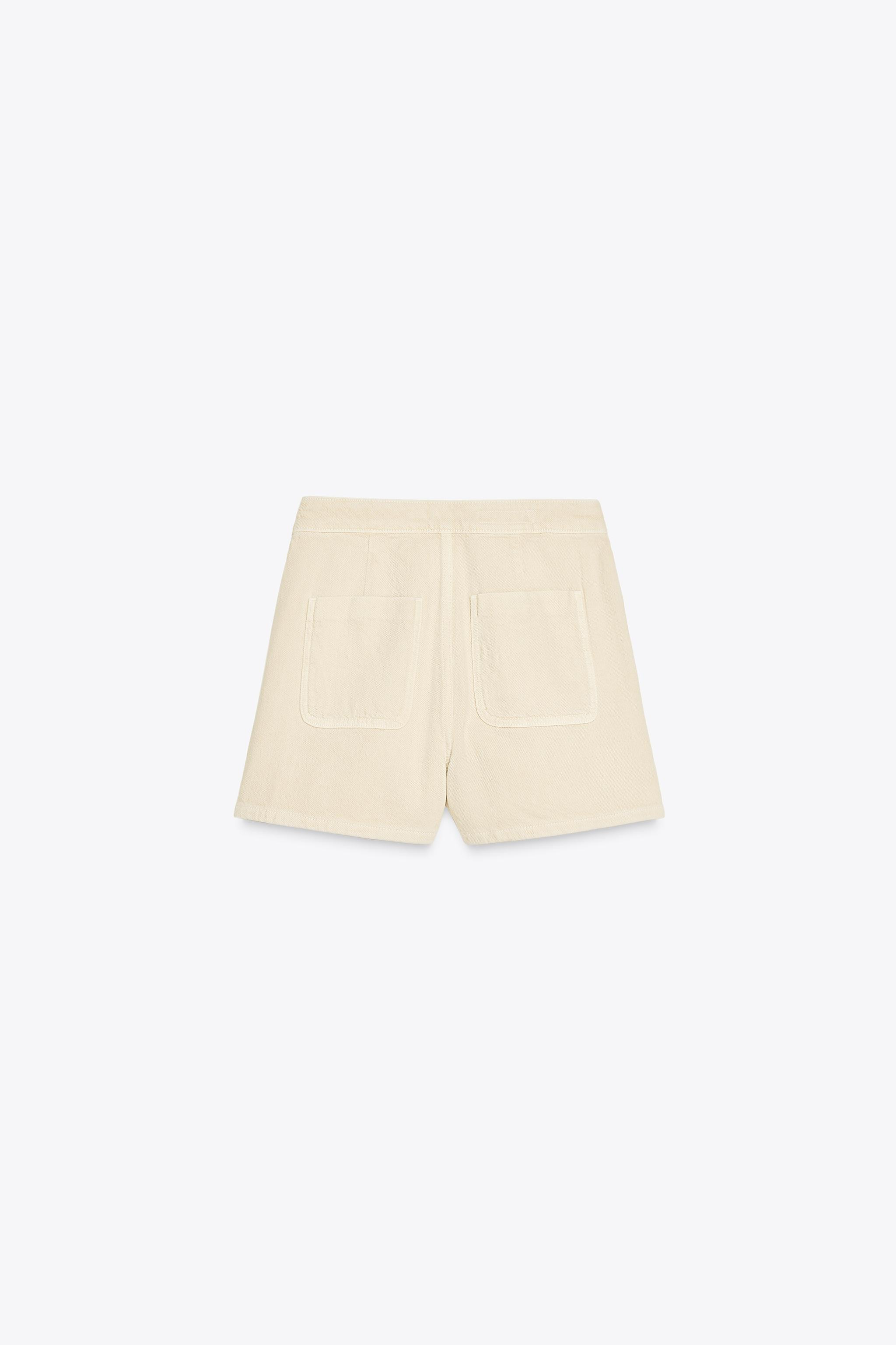 High-waisted skort with crossover front and back patch pockets. Hidden zip and button closure. | Zara US