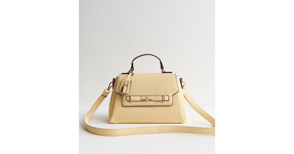 Light Yellow Faux Leather Turn Lock Top Handle Crossbody Bag | New Look | New Look (UK)