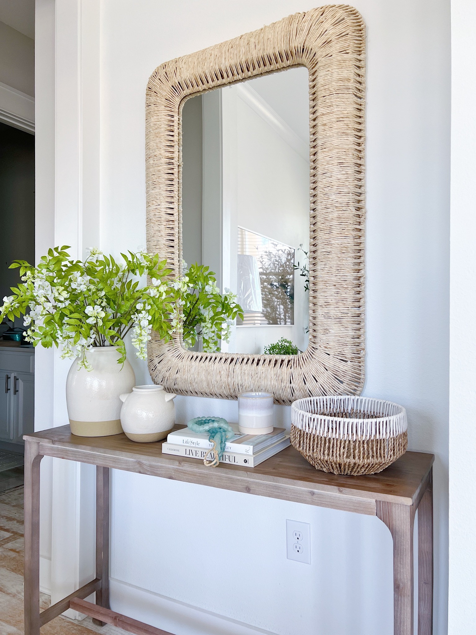 Console table and my favorite rattan mirror!! 

#LTKhome #LTKSeasonal