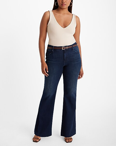 Mid Rise Dark Wash Raw Hem FlexX '70s Flare Jeans | Express