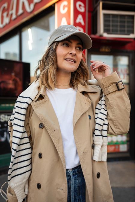 Easy spring outfit idea 🌷

White tee / trench coat / stripe sweater / baseball hat

#LTKfindsunder100 #LTKstyletip
