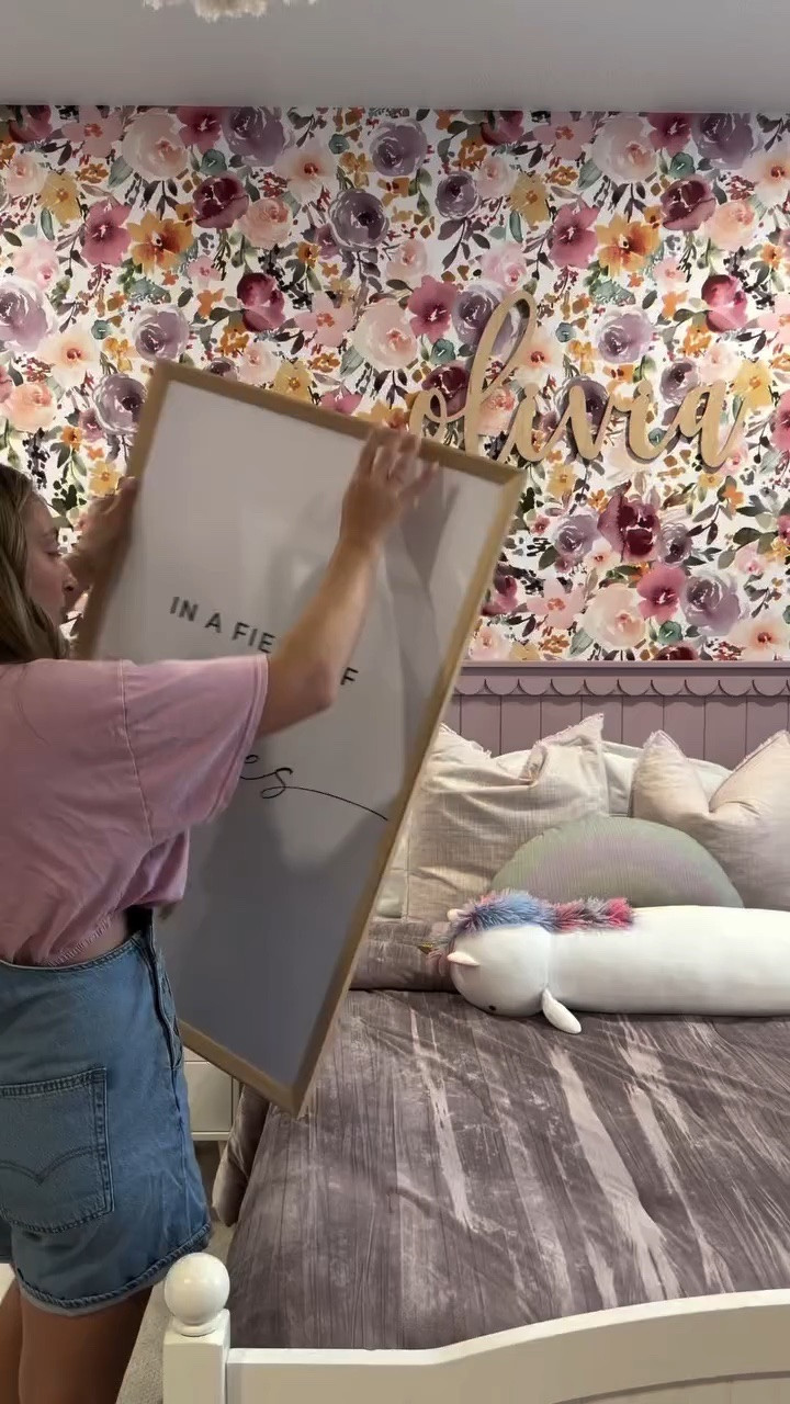 details below ↓ follow along for more mom hacks, home inspo + DIY ✨

I have been doing this hack for as long as I can remember and it’s so easy and affordable. comment a 🤍 for links to the wall art in our home + framed 

1. find the size frames you want, I love the poster frames at target and they are usually $10-$25
2. go on Etsy and search whatever type of file you’re looking for, I usually put the color scheme and what im looking for “pink girls playroom art digital” they are usually under $5
3. send to local @walgreens, they have same day p/u and always have a big discount code 
4. done ✔️ 

#kidsplayroom #wallart #homeinspo #diyhome #momlife