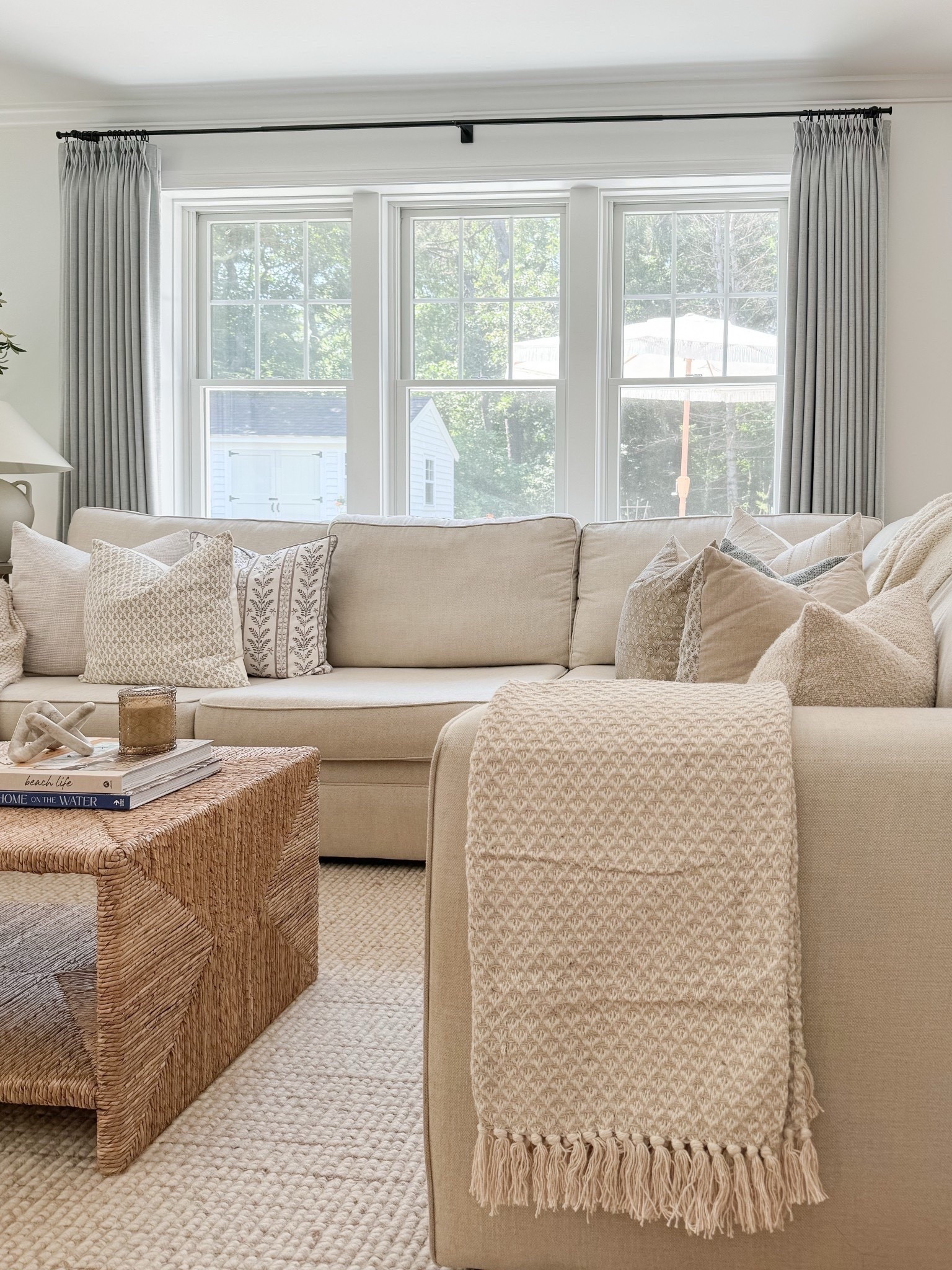 Proof that mixing neutrals can still provide a lot of personality 🤍. This was one of the most loved posts from last summer, and it felt like the right time to bring it back to my feed! Many of these finds are on sale right now, and several of the throw pillows seen here are affordable Amazon picks. I also found some more budget-friendly dupes for the side table and lamp I have in this room!

#LTKHome #LTKSaleAlert