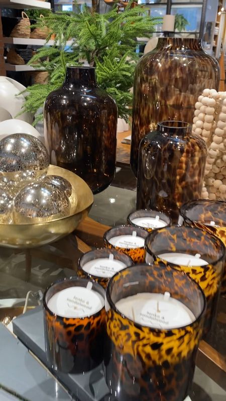 Video Shop with me for trending tortoise shell decor! Tortoise Glass Candles - Here's why you'll absolutely adore them!

Looking for a fantastic housewarming gift or a charming addition to your tabletop decor? These unique candles aren't just candles; they're gentle nudges to savor life's small pleasures. 🕯️

🔹 Crafted from elegant glass.
🔹 Infused with delightful scents.
🔹 Available individually or in sets of 2, 4, or 6.

And the fragrance? It's a symphony of notes, from ozone to jasmine, incense, oud, vetiver, tonka, and jasmine petals. 

Light up your life with these candles – they're more than just wax and wick, they're reminders to slow down and cherish the little moments. ✨🕯️

🌟 Hurry, Limited Time Sale: Tortoise Shell Glass Vases - Here's why you'll fall in love with them!

Searching for that perfect vase to showcase your favorite blooms? Look no further, these Tortoise Shell Glass Vases are about to steal your heart. ❤️

🔹 Crafted from exquisite soda lime glass.
🔹 Timeless centerpieces for your beautiful flowers.
🔹 Meticulously mouth-blown with precision.
🔹 Adorned with a stunning Tortoise finish.
🔹 Watertight for your floral masterpieces.

Whether you need one to make a statement or a set to create a mesmerizing arrangement, these vases have you covered. Don't miss out on this limited-time offer – they're the epitome of understated elegance. 🌷🕰️

Introducing for 2023: New Large Mercury Ball Ornaments (Set of 4). Here's why you're going to adore them!

🎄 Looking to add a touch of glamour to your Christmas tree this year? These Mercury Ball Ornaments are your answer.

🪄 Each ornament discreetly captures and dances with the shimmering holiday lights, turning your tree into a radiant spectacle.

🌟 And with a set of four, you can effortlessly achieve a cohesive and polished look for your tree decor.

Don't miss out on the chance to elevate your holiday decorations with these captivating ornaments. They're the perfect way to make your tree shine even brighter this Christmas. 🌲🌟
Thanksgiving decor, masculine decor, fall decor, viral

#LTKhome #LTKGiftGuide #LTKVideo