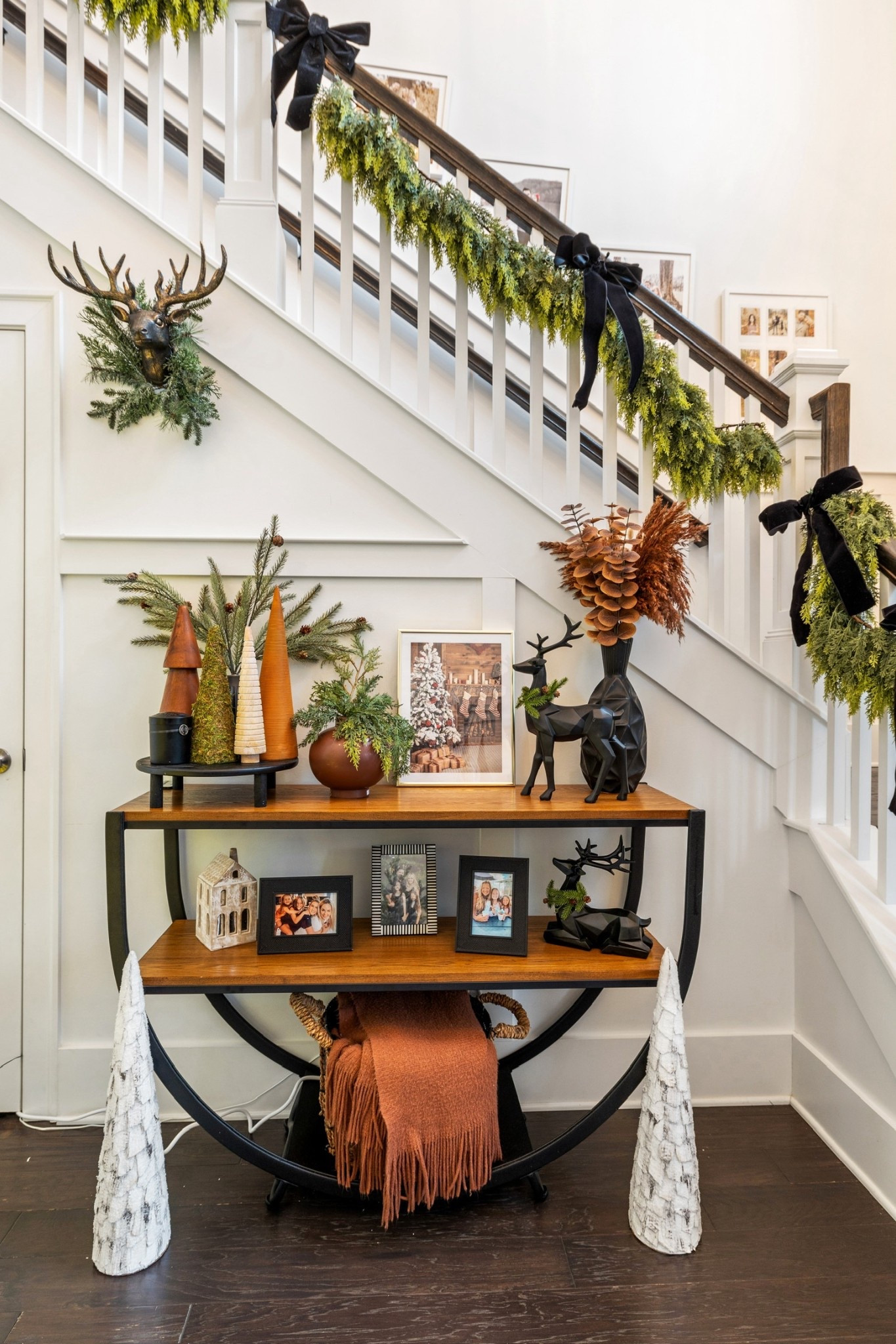 Christmas time is here! Sharing my entry way look with you because everyone loved it last year! Bows are back and the garland is a must-have 🖤 

#LTKSeasonal #LTKHoliday #LTKFindsUnder50
