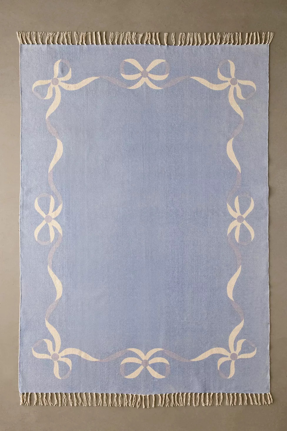 Lacey Bows Unbrushed Printed Rug | Urban Outfitters (US and RoW)