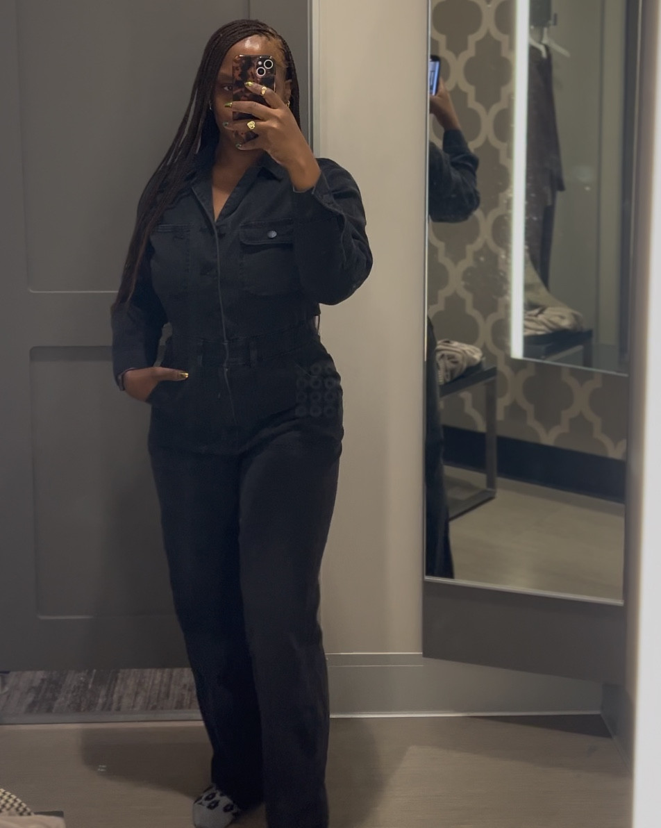 Dark denim jumpsuit. I’m wearing a size 8. Slightly stretchy  