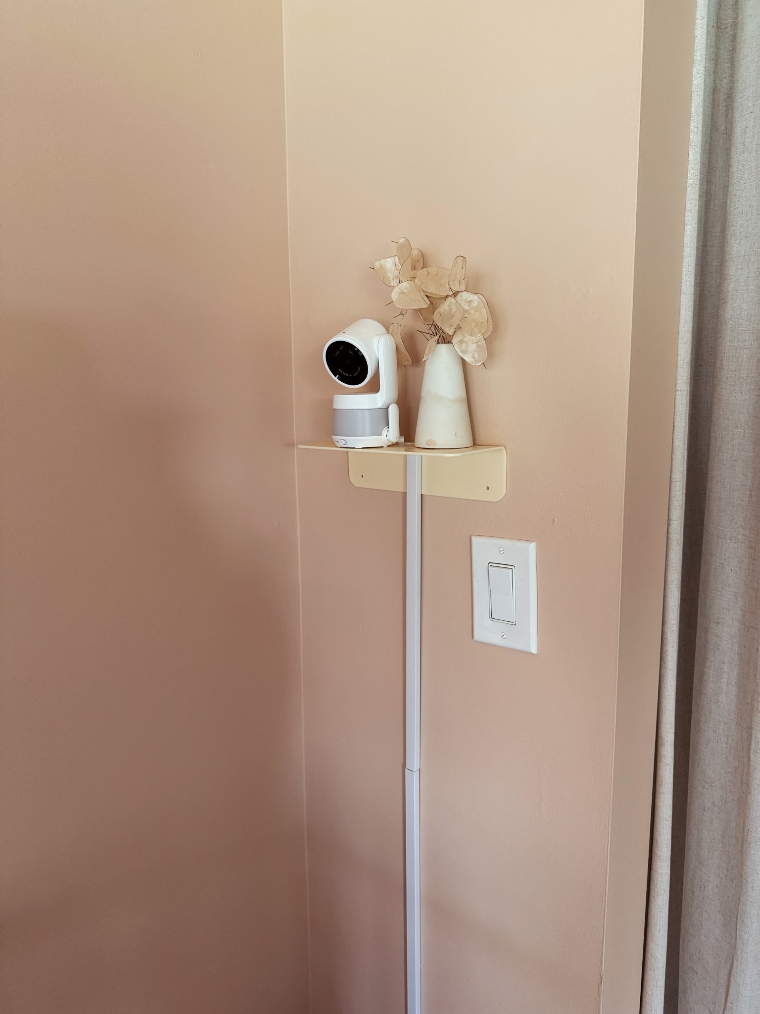 i searched a LONG time for a baby monitor that had a screen but ALSO an app, not sure why that isn’t a more popular request! bonus points for the screen being massive and pretty decent video quality! i’m really happy with this one.

i got this little cute shelf to put it on and covered the cord, i meant to paint the cord cover but never did 😆

#LTKHome #LTKKids #LTKBaby