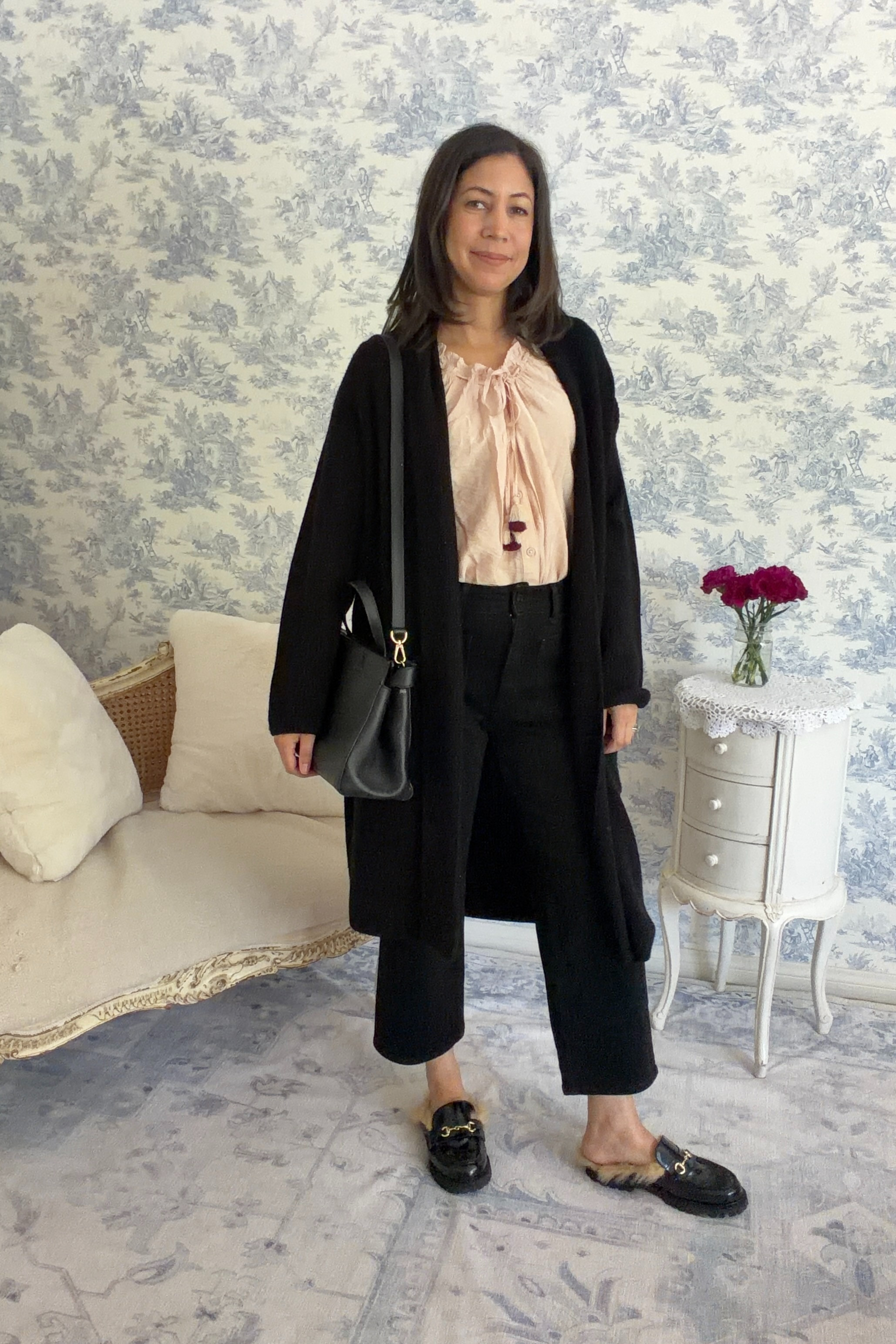 Layers are the key to a comfortable fall. This sleeveless blouse from Walmart (yes, Walmart!) looks fabulous paired with a long duster cardigan and cropped black jeans from Quince. The shoes are Thursday Boots Mules with shearling and the bag is by Teddy Blake. 

 #LTKootd #LTKSeasonal #LTKOver40