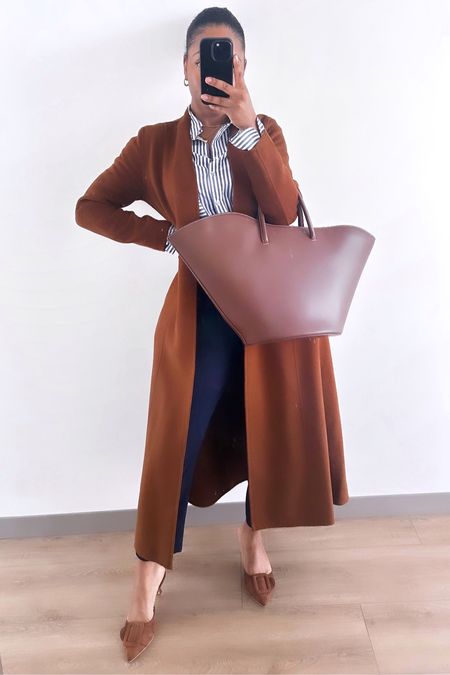 Classic workwear. Brown long coat, pinstriped button down, navy pants, brown mules.

#LTKworkwear
