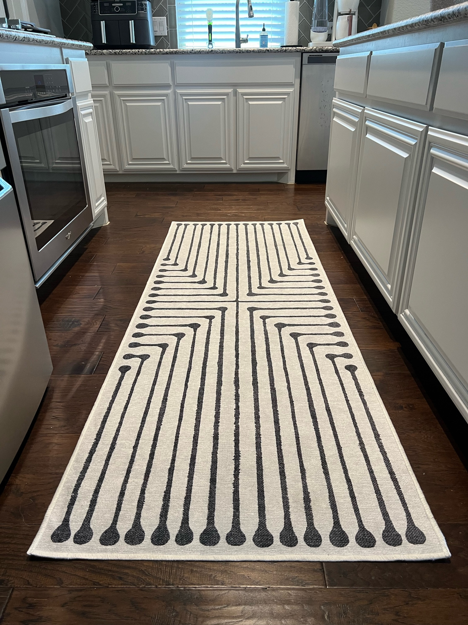 My kitchen runner is just $209 right now! This Ruggable rug is one of my most asked about rugs in our home. Washable & sleek! Goes with many different styles 🖤🤍

#LTKhome #LTKsalealert