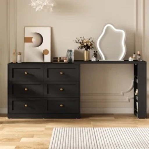 This black extendable makeup vanity from Wayfair feels more like a styled bedroom console than a typical beauty station, which is probably my favorite thing about it. The six drawers give you a lot of hidden storage, and the long top leaves room for skincare, perfume, a lighted mirror, and a few pretty extras without feeling crowded. I like the little gold-tone knobs against the black finish, especially with the sculptural wall art, flower vase, and striped rug.