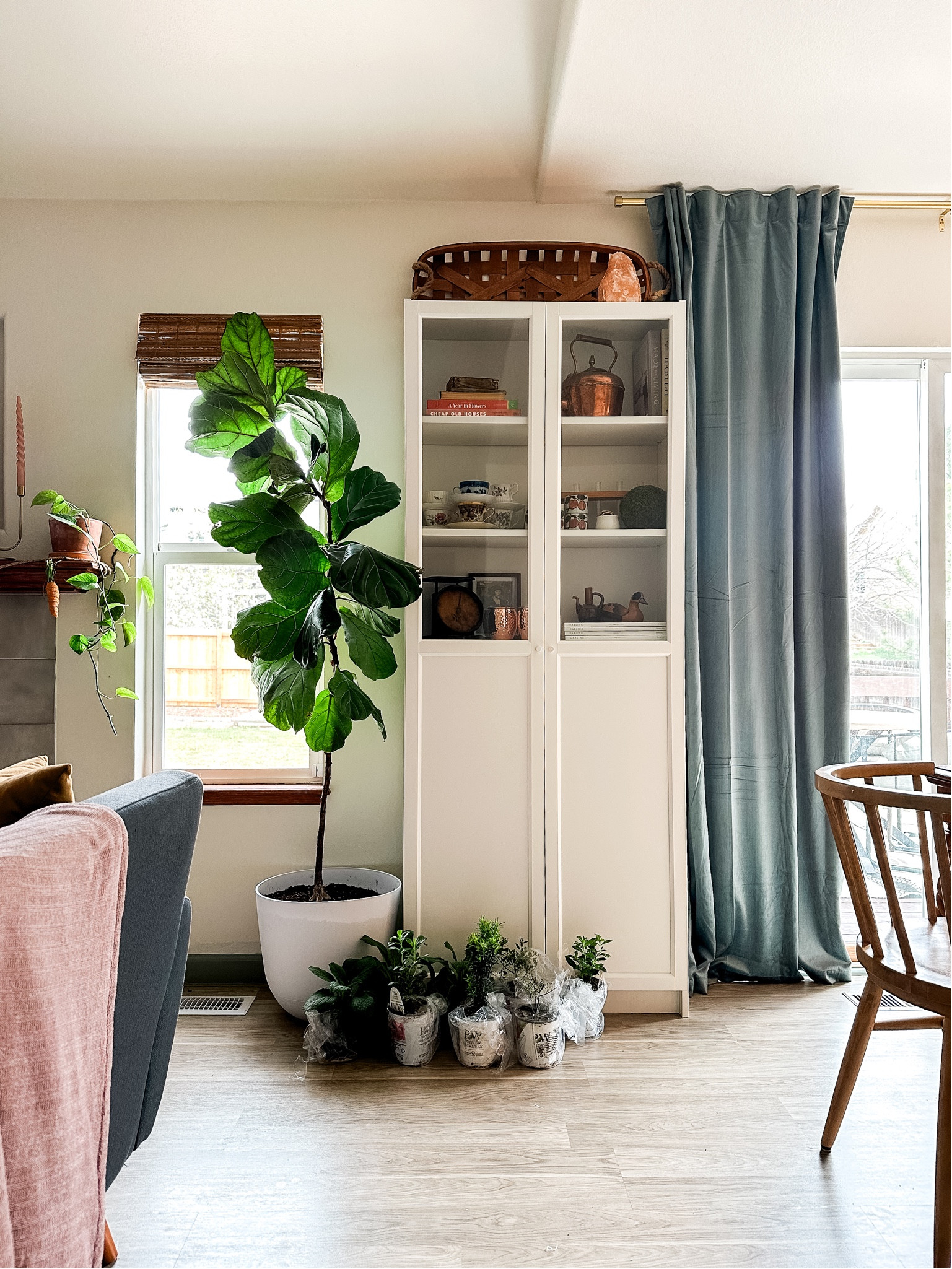 A happy little corner of the house. Love these big slate blue velvet curtains with all our wood and tan accents. They were such an affordable amazon find! 

#LTKhome