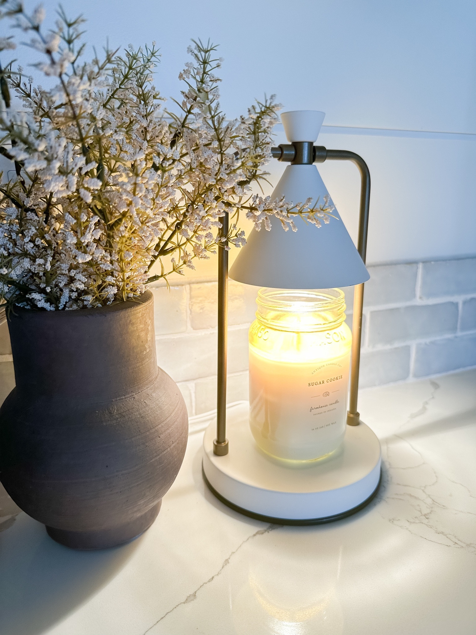 I bought myself a gift and now I want to get one for everyone!  This candle warmer allows you to enjoy the scents of a candle without having to worry about the flame!  I personally think it makes the smell more potent too!  The scent quickly fills the room and you can set it to a timer to have it automatically turn off.  This sugar cookie candle kept tricking my boys!  They thought I was baking a cake!

#LTKHoliday #LTKhome #LTKGiftGuide