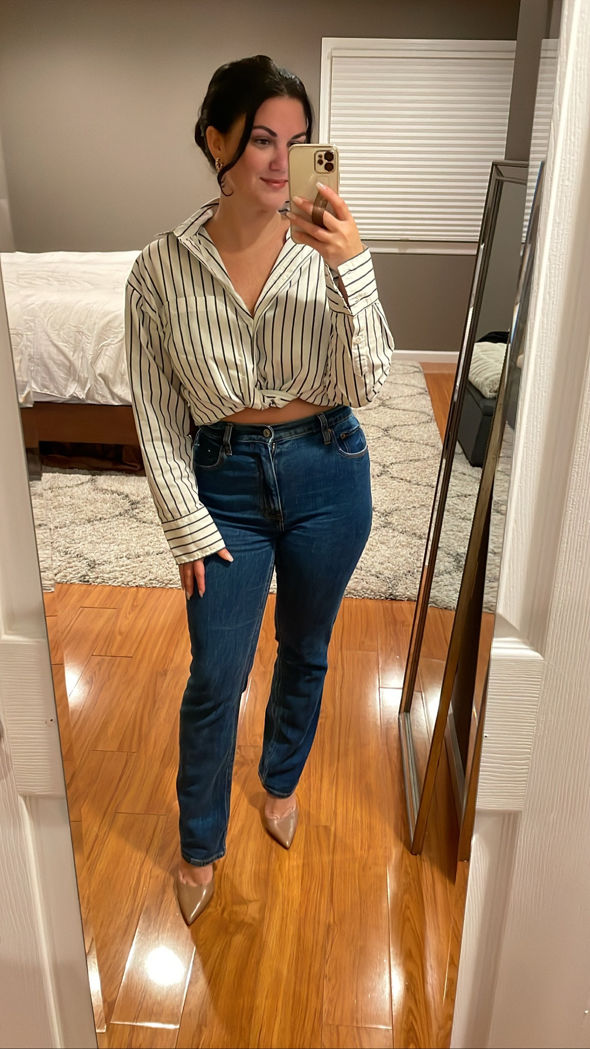 Wearing the oversized poplin button down top. It is very oversized. I actually went down to an xxs and it’s still oversized enough. I tied and tucked it for this look and paired it with the 90’s slim straight ultra high rise jeans. 

#LTKsalealert #LTKSale #LTKstyletip