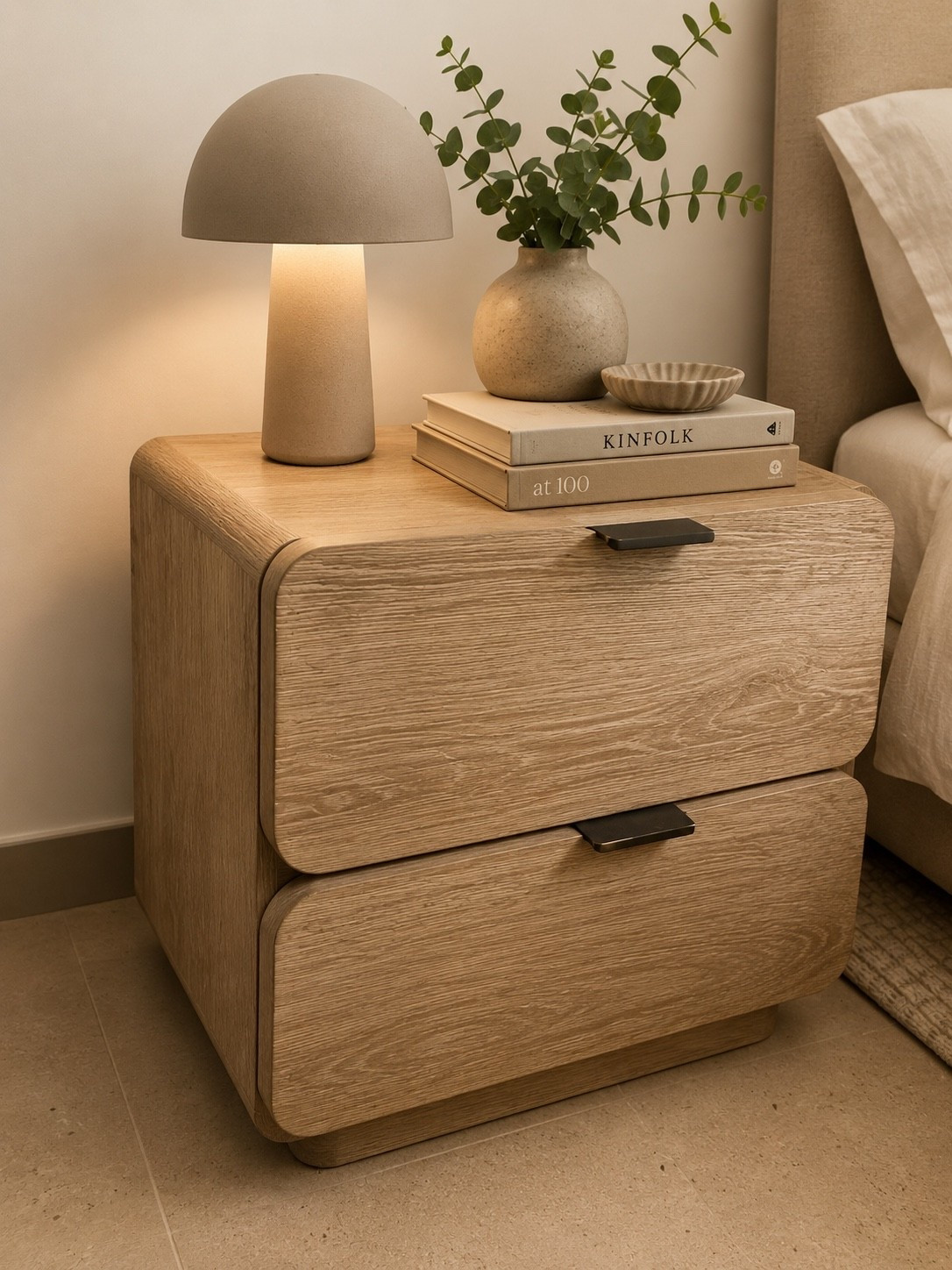 Nightstand styling that proves less is more. 🤍

Rounded oak tones, soft ambient lighting, and a curated mix of textures create the perfect warm-minimalist bedside moment. The details may be simple, but they make all the difference.

#LTKHome #NightstandStyling #BedroomInspo #InteriorDesigner #ModernOrganic #NeutralHome #CozyBedroom #BedroomDecor #InteriorStyling #HomeDetails #JessicaDerasDesignStudio #OrganicModern #LTKStyle #HomeInspo #DesignerFavorites