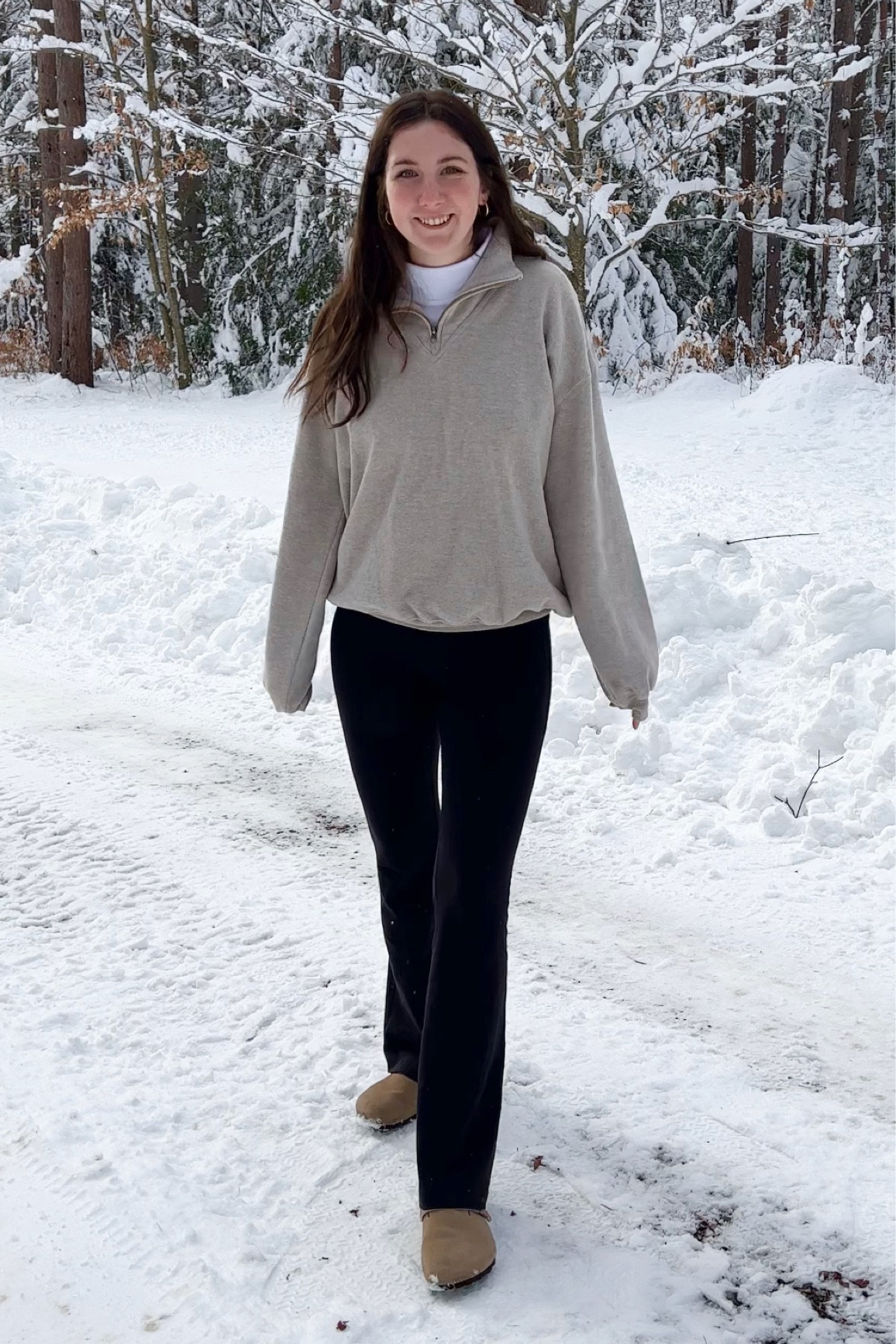White turtleneck, with tan pullover, flared leggings, and Boston Birkenstock winter snow outfit

#LTKSeasonal