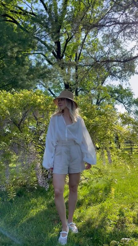 Summer outfit, European vacation style, white blouse, linen shorts, mesh ballet flats, ballerina flats, straw bucket hat

#LTKVideo #LTKTravel #LTKShoeCrush