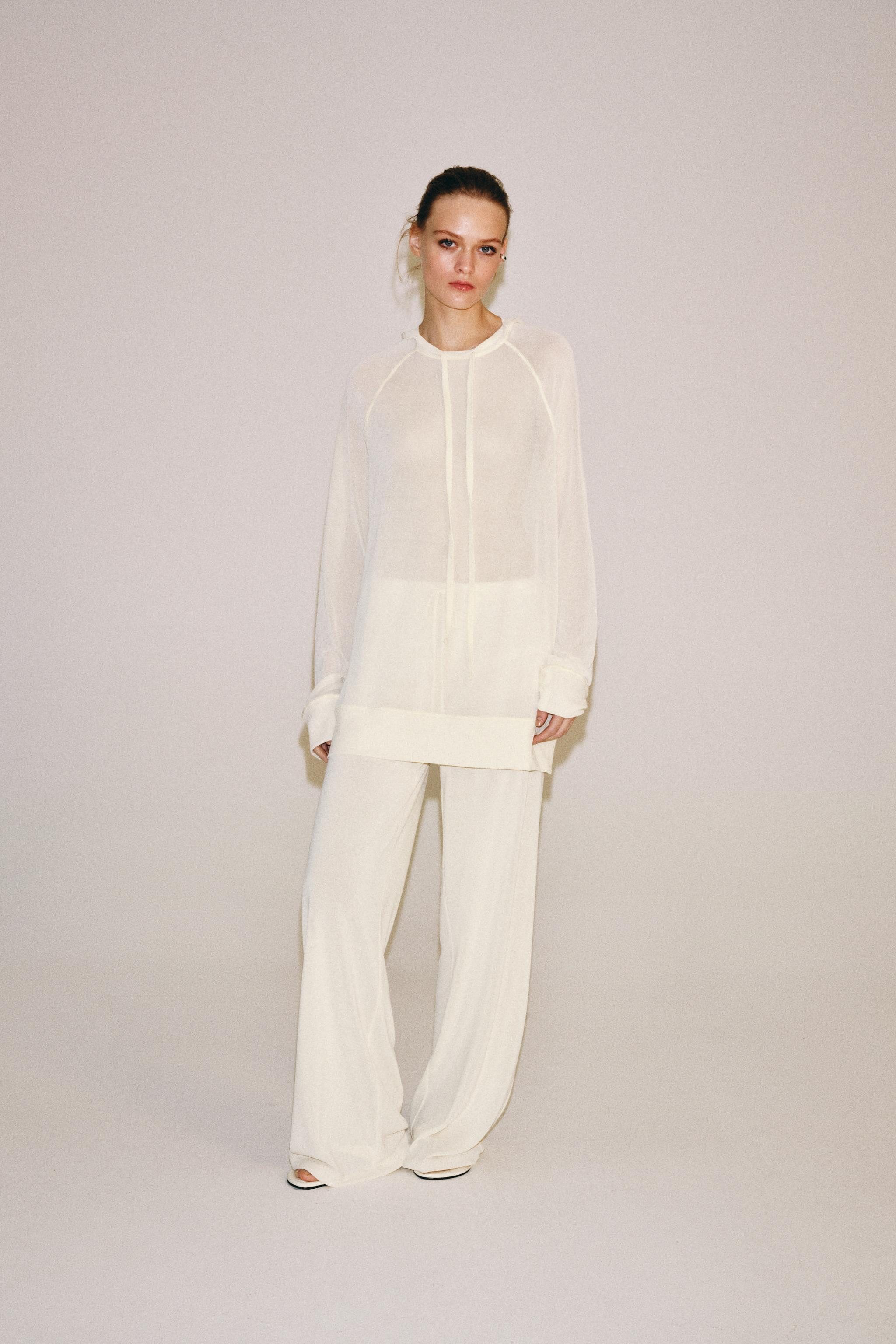 Sweatshirt made of semi-sheer fabric. Round neck with adjustable drawstrings. Long sleeves. | Zara US