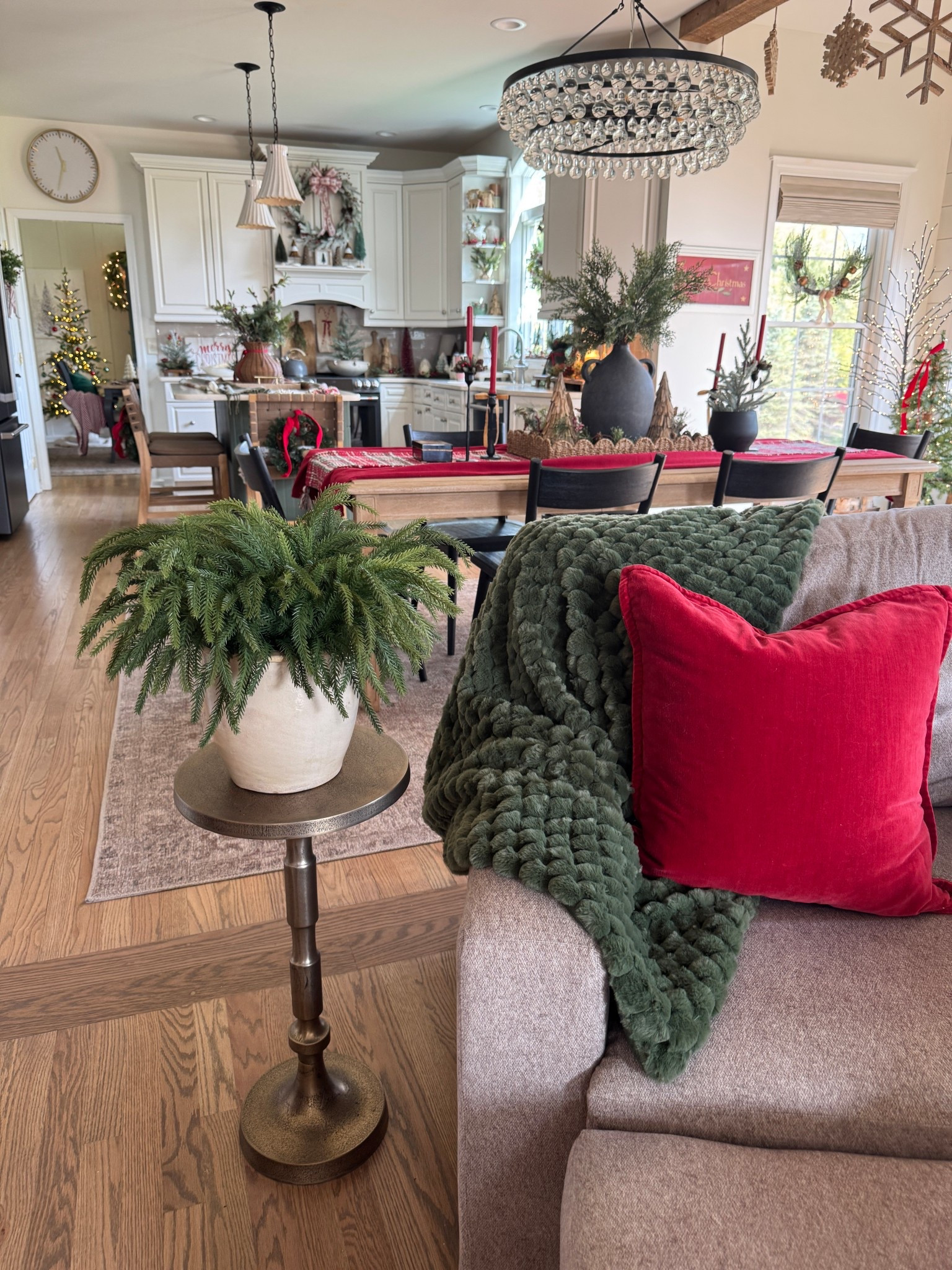 The prettiest soft touch Norfolk pine stems. One of my fave pedestal accent tables in a brushed champagne colored. Pillow cushions and fuzzy soft green throw blankets. Accent chair that swivels and rocks  

#LTKHome #LTKSeasonal
