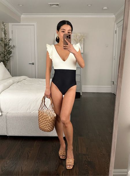 This color of my jcrew straw bag is finally in major sale for 60% off! Love how light it is and he secure drawstring liner bag. 

Use Code JEANWANG10 for $10 off at Summersalt - love their chic and flattering one piece bathing suits

•Summersalt Ruffle Backflip swimsuit size 2 - fits very well and is comfortable and tummy flattering. Also love this same suit in the pink and orange color block option. 
•Sam Edelman sandals sz 5
•J.Crew basket bag
•Sezane earrings 

#petite beach and pool vacation outfits 

#LTKswim #LTKtravel #LTKSeasonal