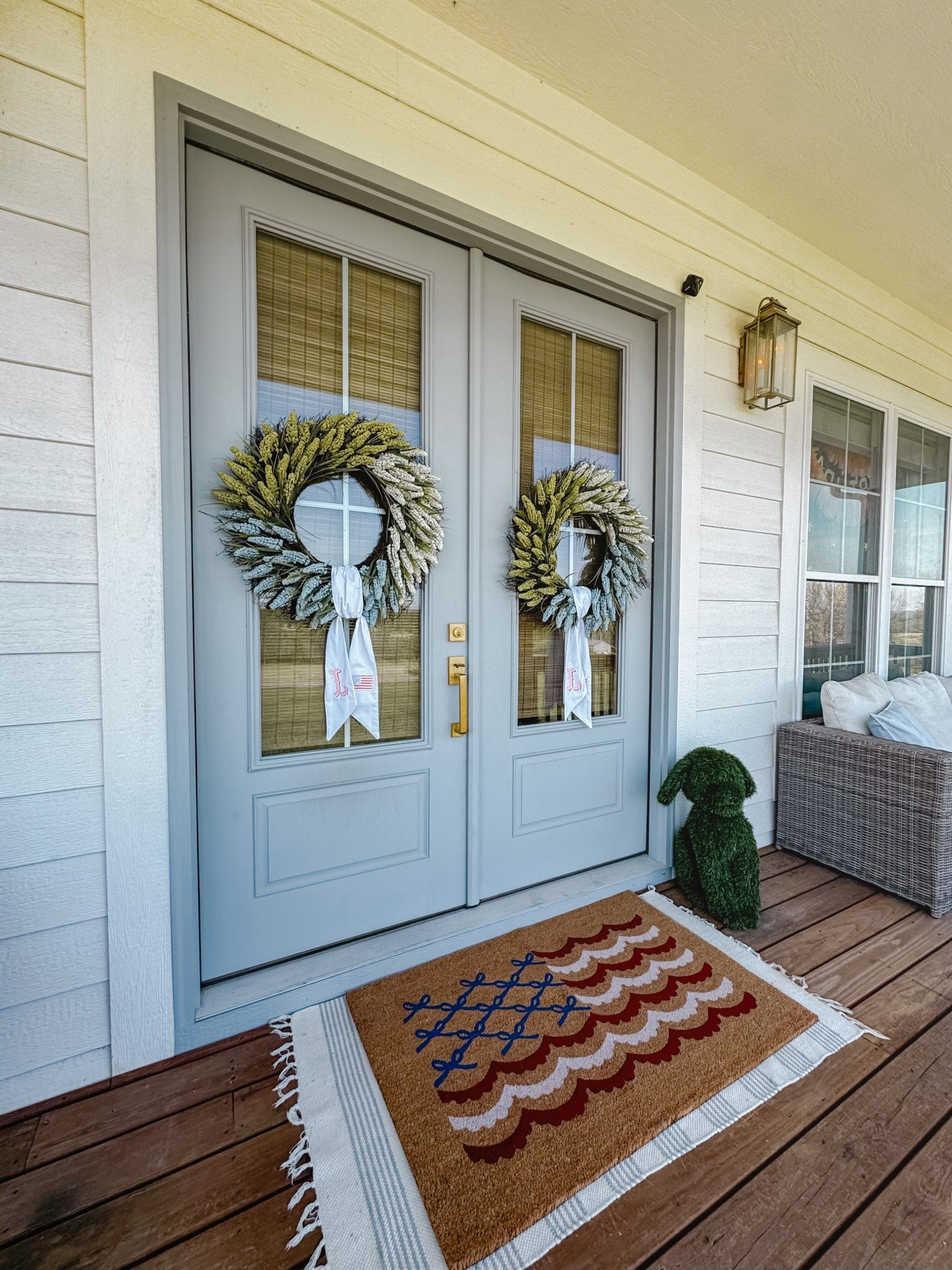 Front porch refresh for spring. Wreath sashes are from https://designsbm.com // front door mat // front door wreath // porch reset // summer outdoor decor // Memorial Day // 4th of July 

#LTKSeasonal #LTKHome