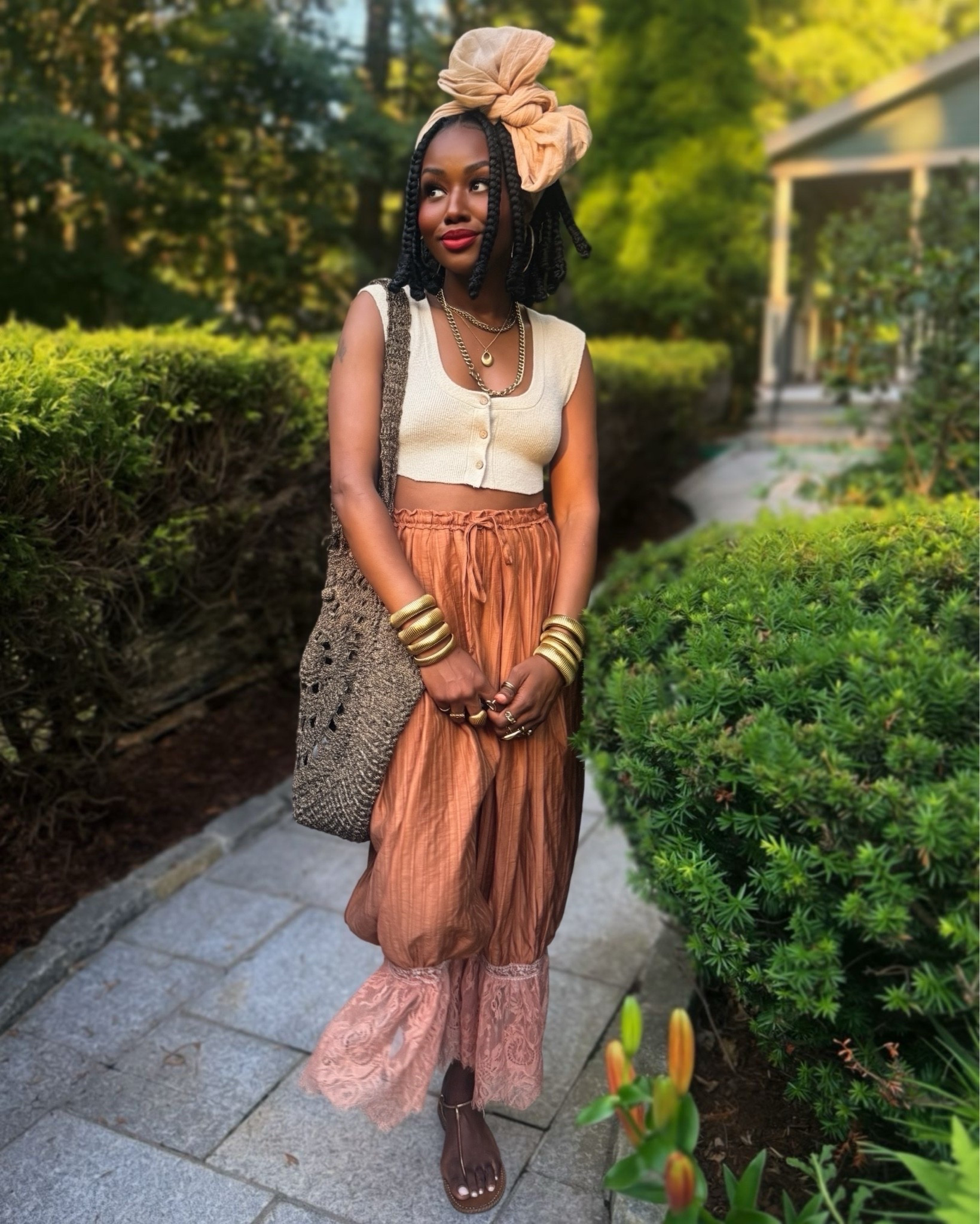 Summer neutral outfit featuring lace-trim bloomer pants, a knit crop tank, a crochet shoulder bag, stacked gold bangles, flat sandals, and a cute headwrap. This is the kind of effortless summer outfit I reach for when I want to feel comfortable without sacrificing style. Perfect for vacation, brunch, travel days, weekend plans, or everyday wear.

#LTKootd #LTKPetite #LTKOver40